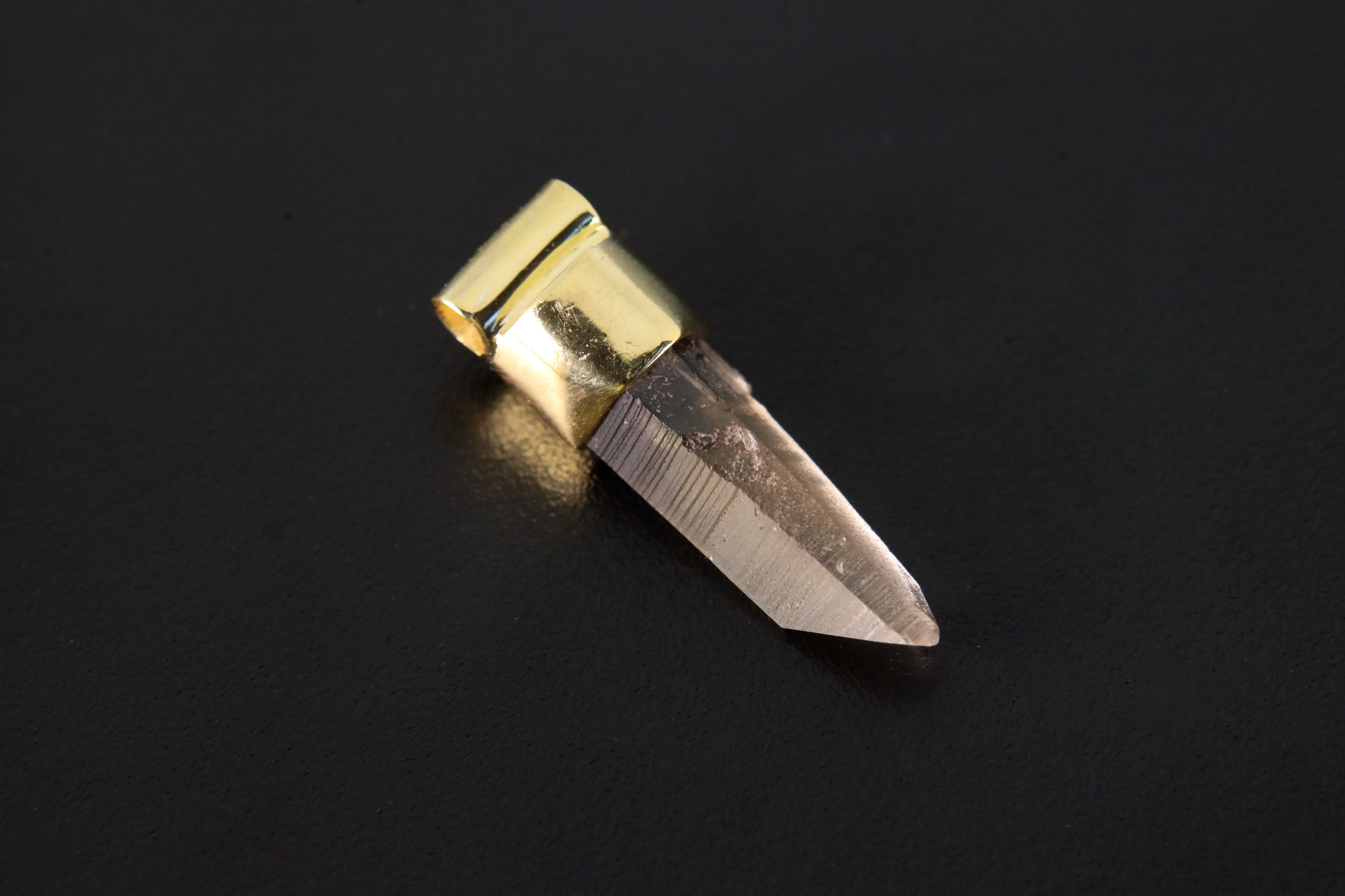 Australian Lemurian Citrine pendant charm shown on dark background with gold-plated silver cap and pointed crystal.
