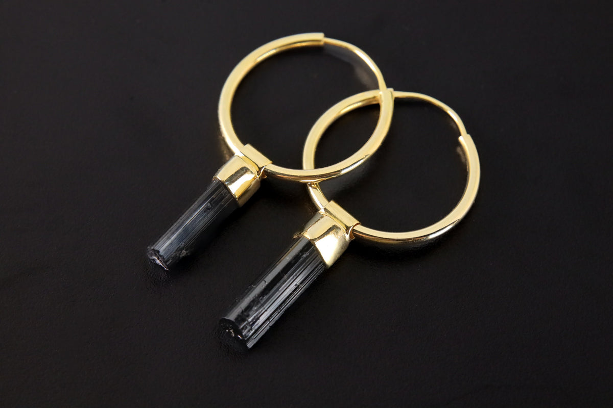 Black Tourmaline convertible hoop earrings in gold-plated 925 sterling silver with raw black crystal wand drops.