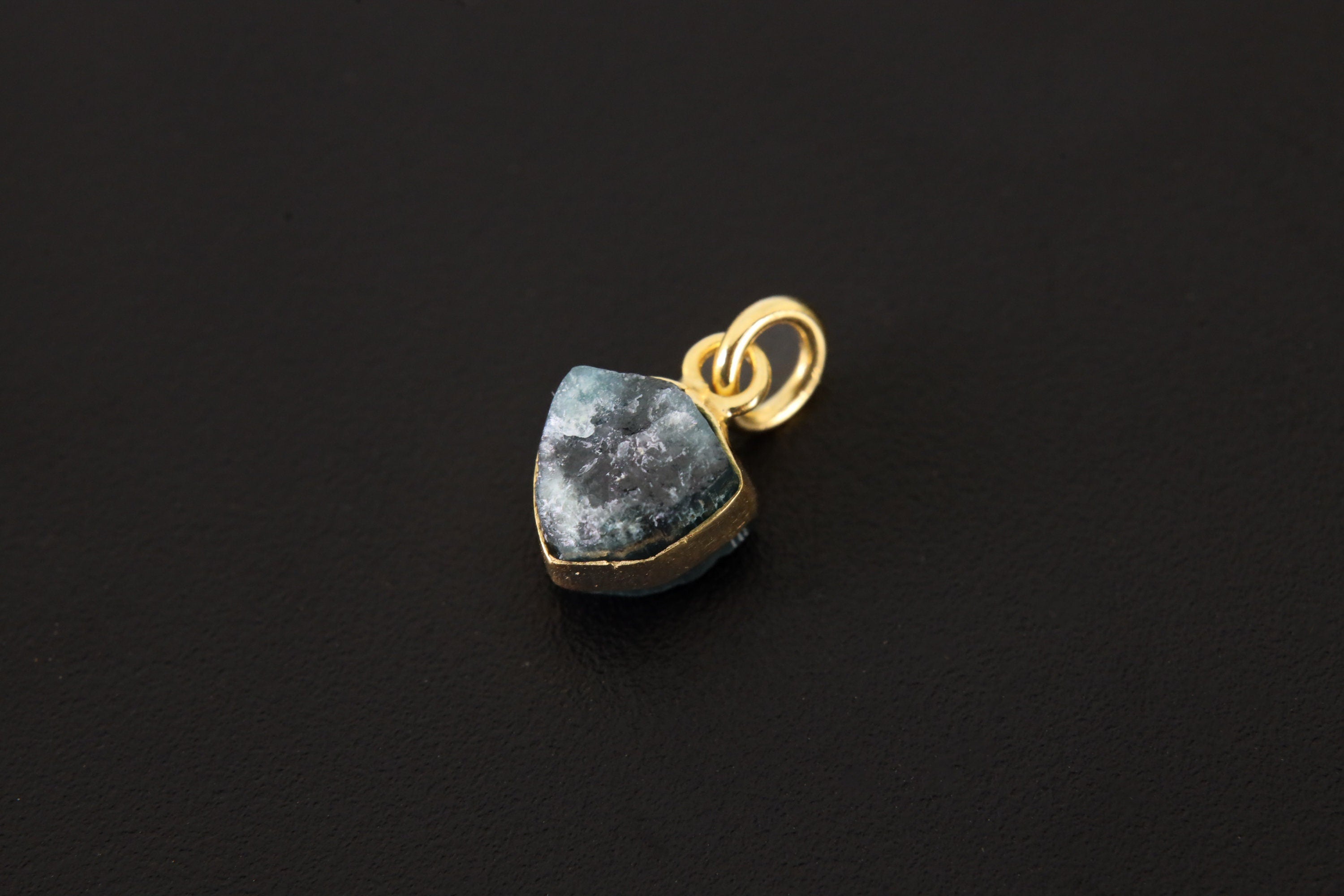 Blue Tourmaline gold-plated dangle hoop earring displayed as a small convertible pendant charm.