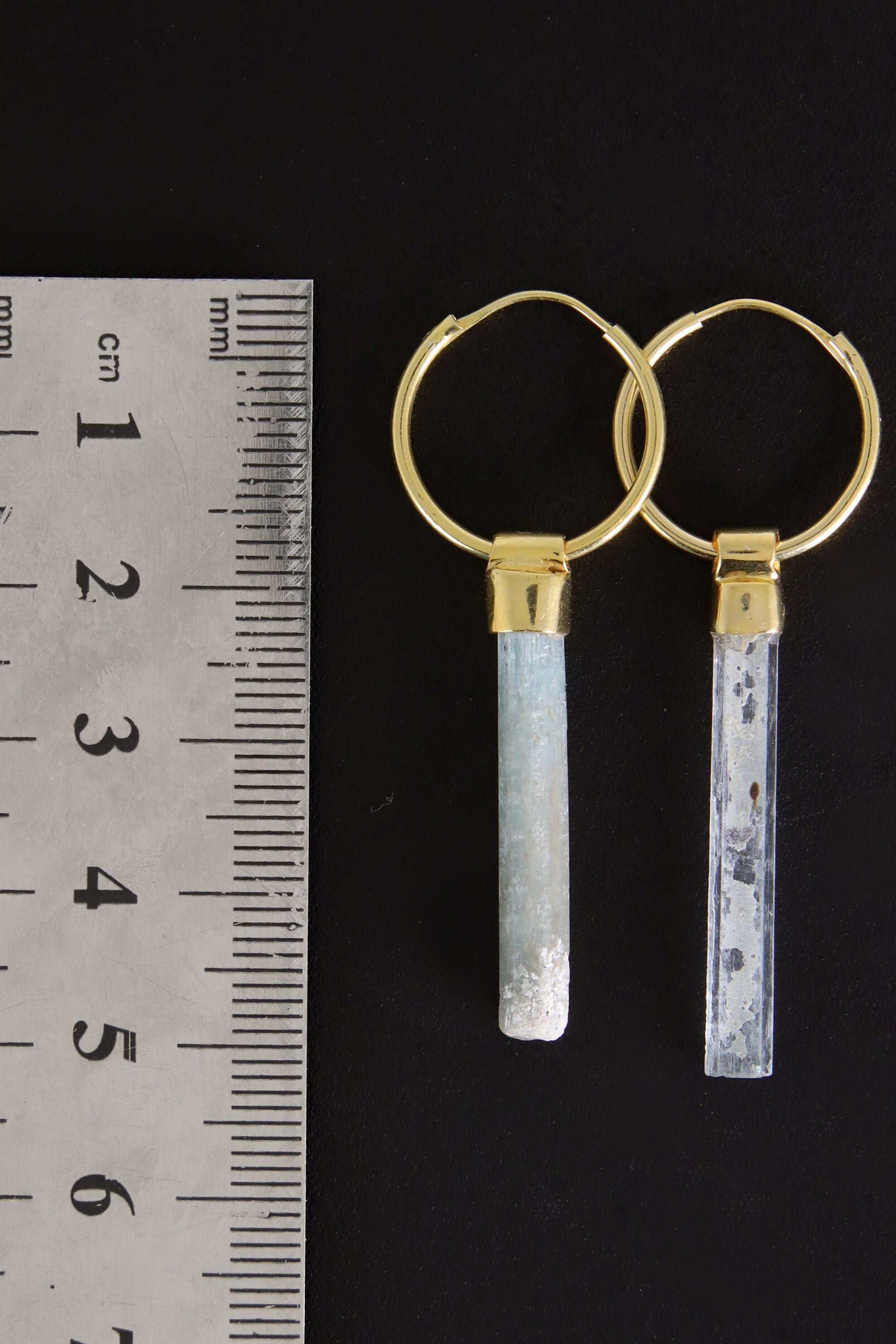 Australian Aquamarine gold hoop earrings shown beside a ruler for scale, with convertible gemstone charms.