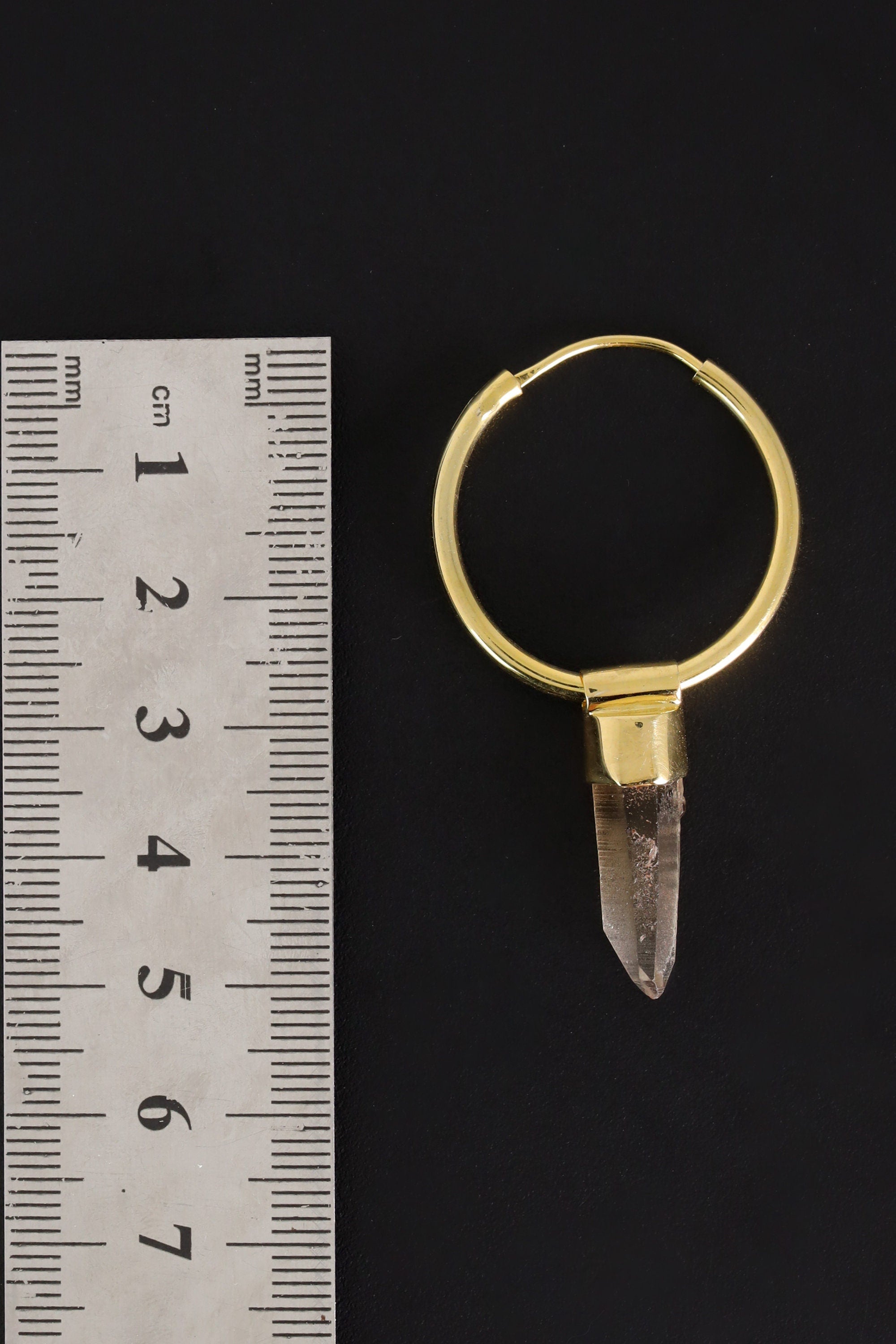 Lemurian Citrine gold-plated hoop earring pendant shown beside a ruler for scale as one single piece.