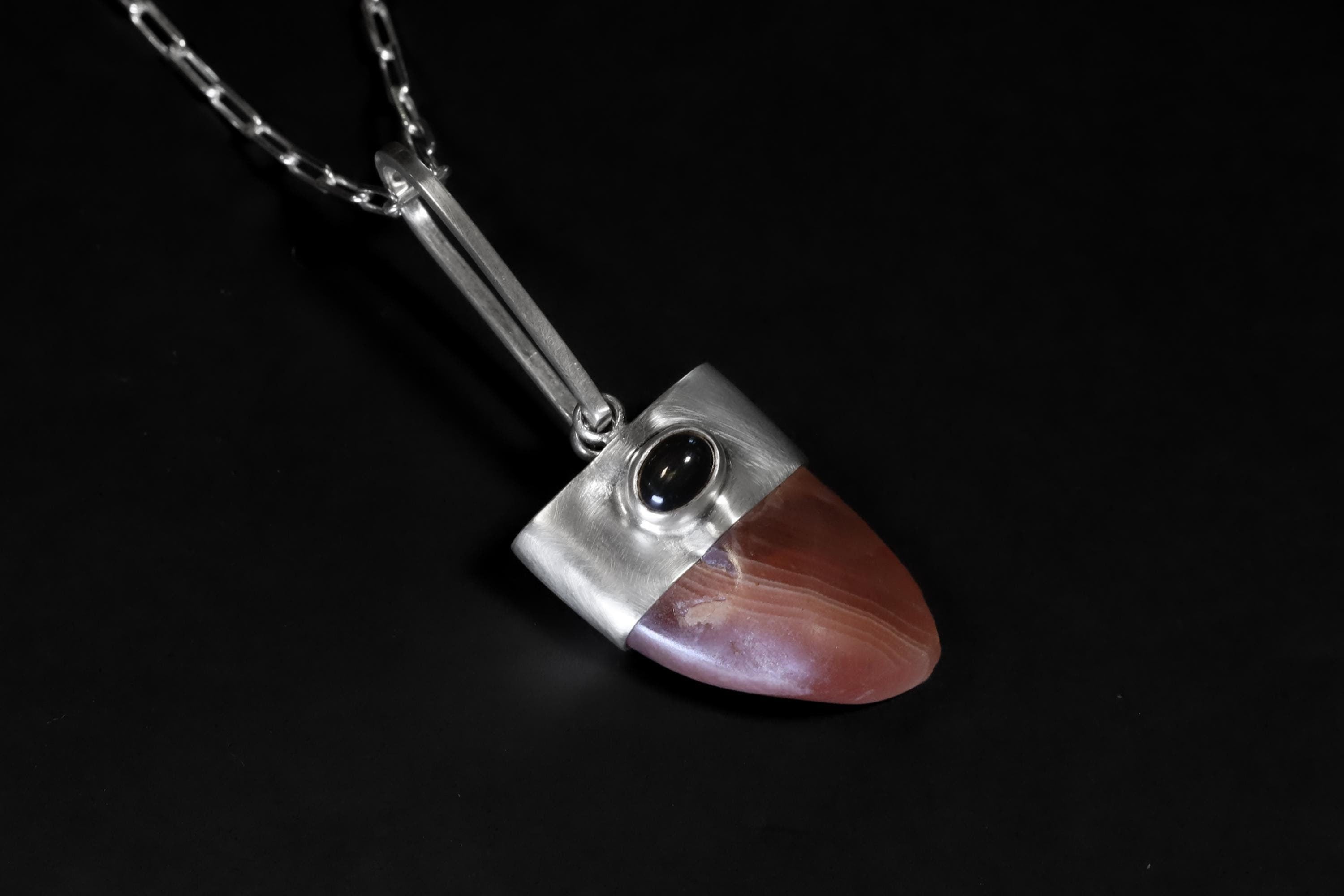 Tooth-shaped gemmy Hand-Polished Rhodochrosite Pendant with Fancy Oval Dark Star Sapphire Cabochon, Heart & Third Eye Chakra, Unique Gift