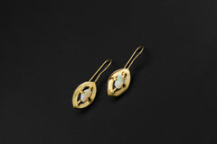 Australian White Opal earrings shown on a dark background with gold-plated hooks and delicate halo settings.