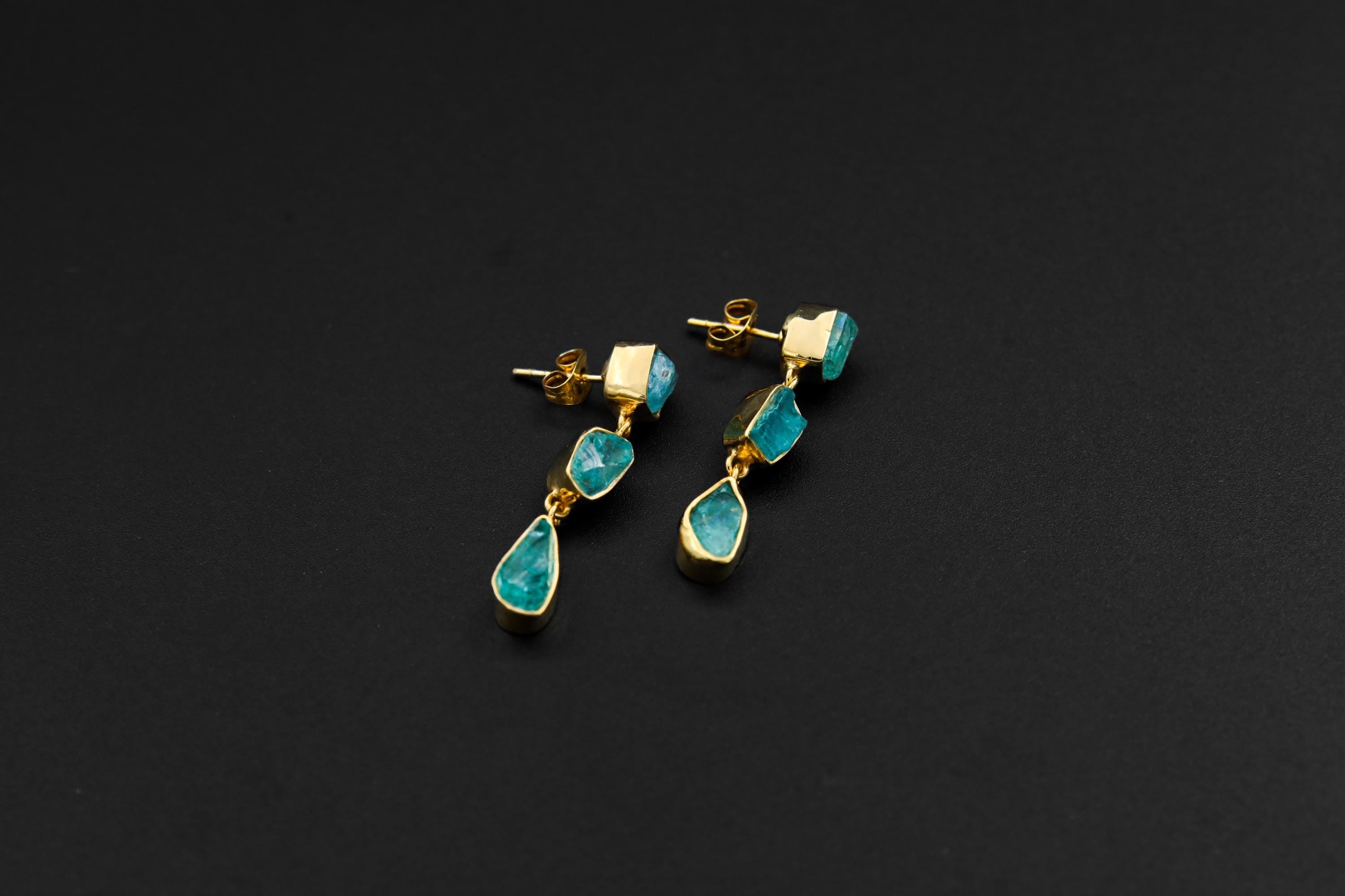 Pair of raw Blue Apatite gold-plated drop earrings with organic silver forms and three crystal dangles on each earring.