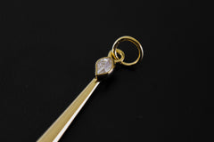 Close-up of Herkimer Diamond set at the top of a gold-plated ceremonial spoon pendant.