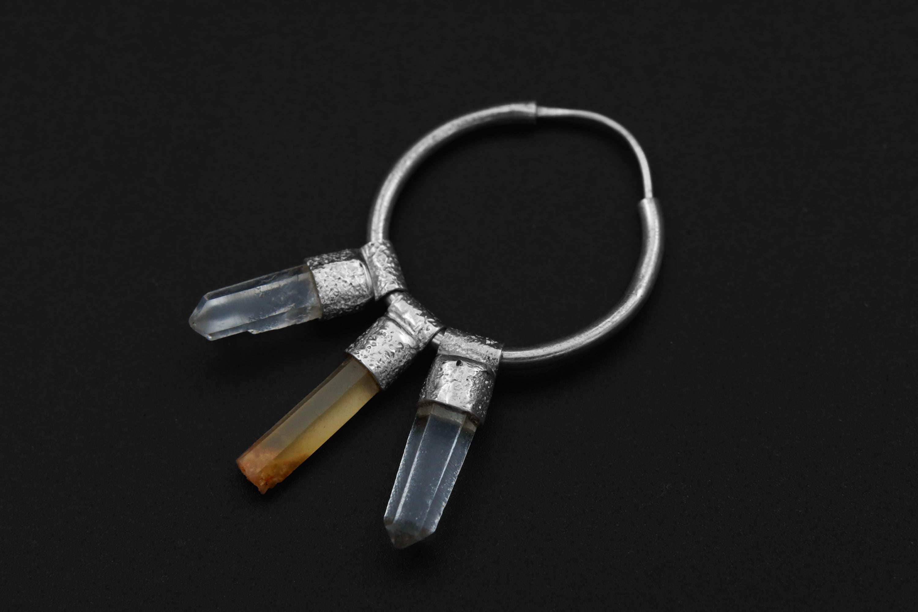 Close-up of Lithium Quartz and Clear Quartz pendant-style hoop charm showing polished sterling silver and raw crystal drops.