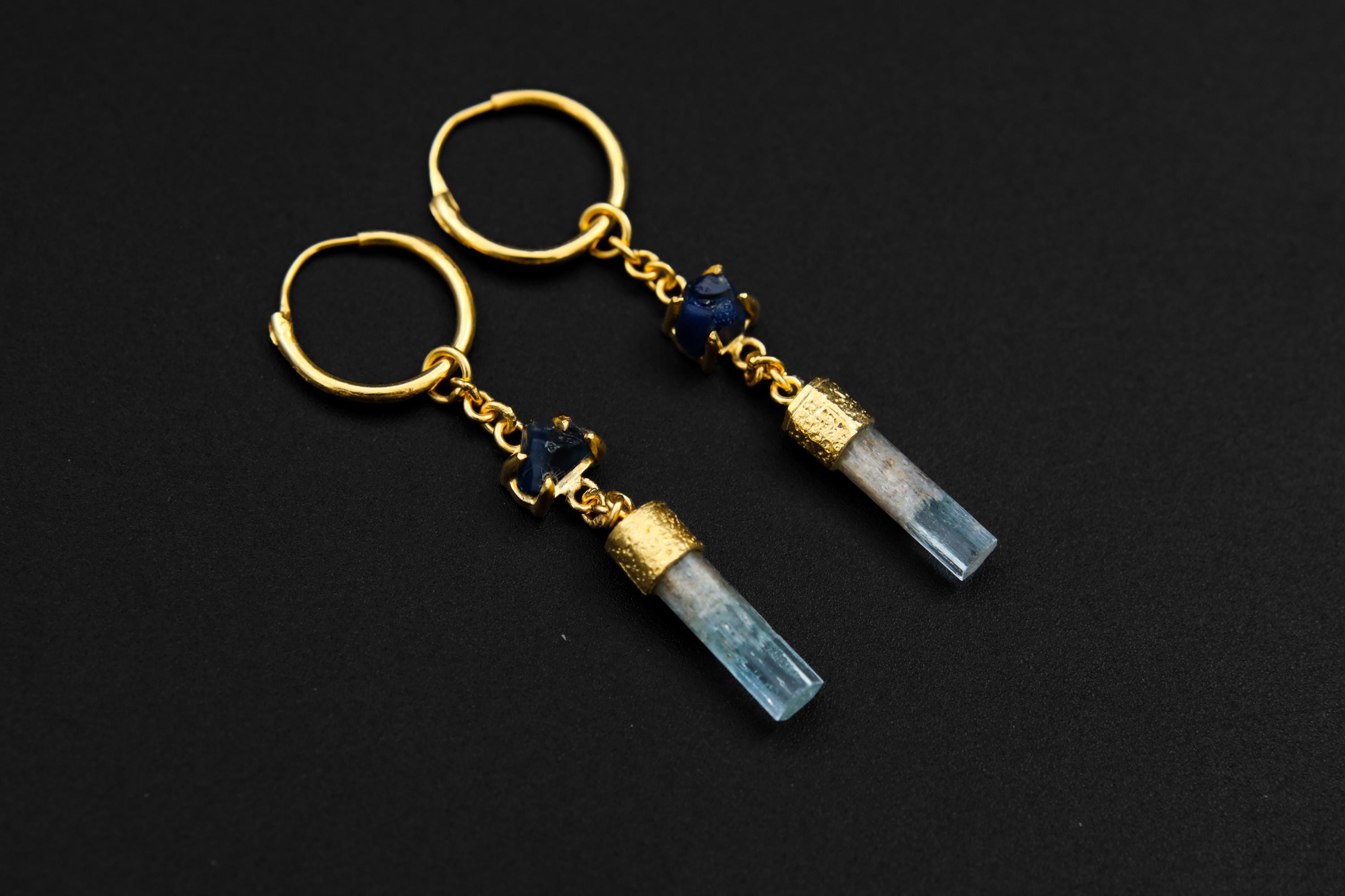 Sapphire Aquamarine hoop earrings shown as a pair with gold-plated sterling silver and blue gemstone dangles.