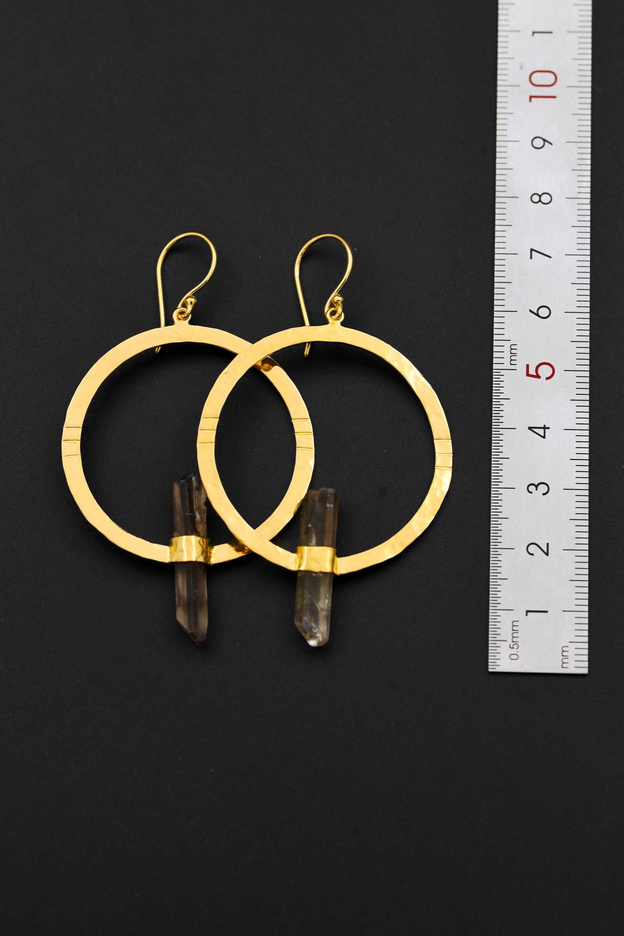 Fossicked Australian Smoky Quartz earrings shown beside a ruler for scale, with oxidized silver portal frames and gold hooks.