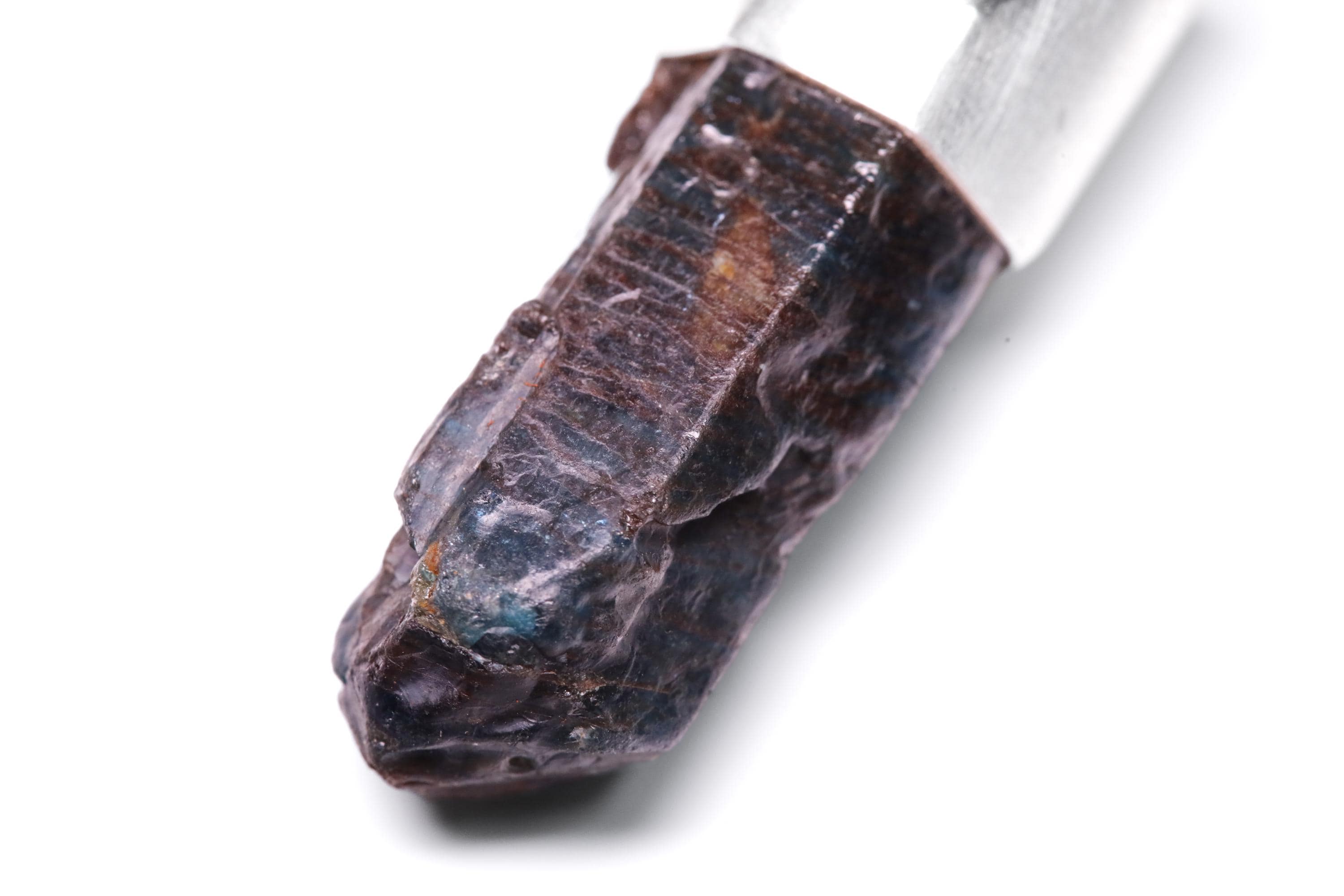 Close-up of terminated Blue Apatite Generator Point showing dark blue crystal texture and handmade sterling silver setting.