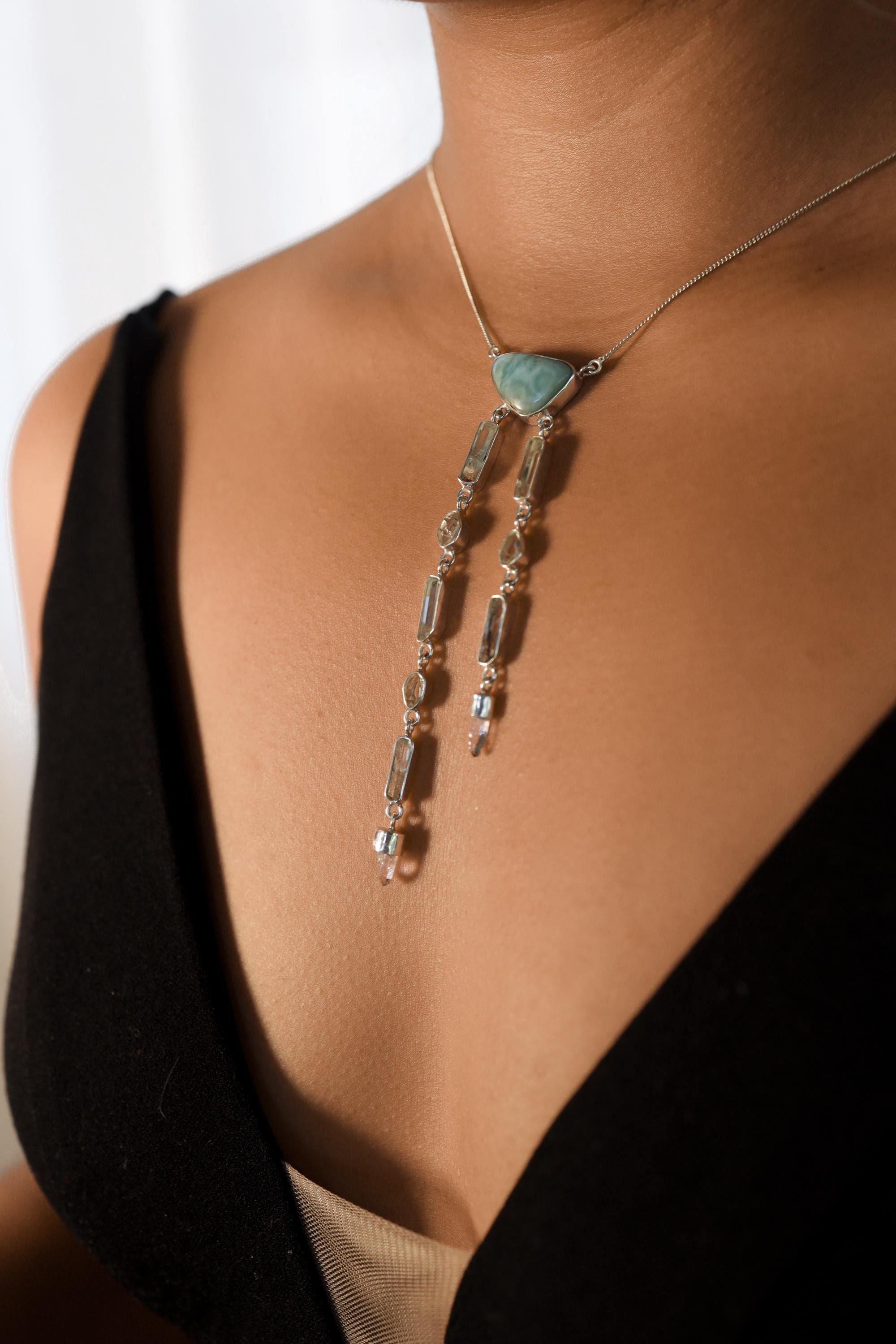 Atlantian Larimar Ocean Talisman shown worn on a model, with Larimar centrepiece and cascading crystal strands.