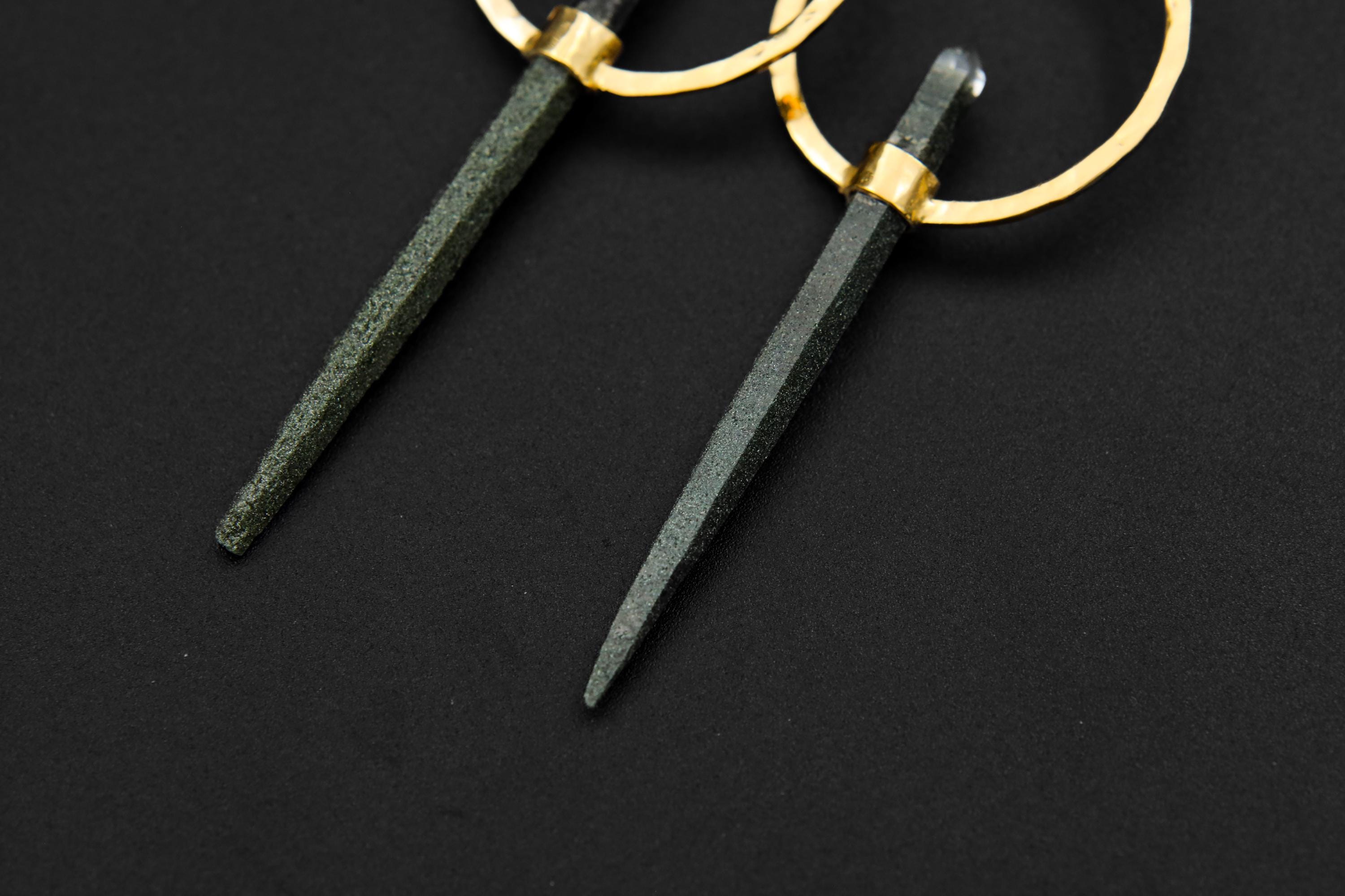 Close-up of Chlorite Phantom Quartz earrings showing earthy green inclusions inside clear double-terminated crystals.