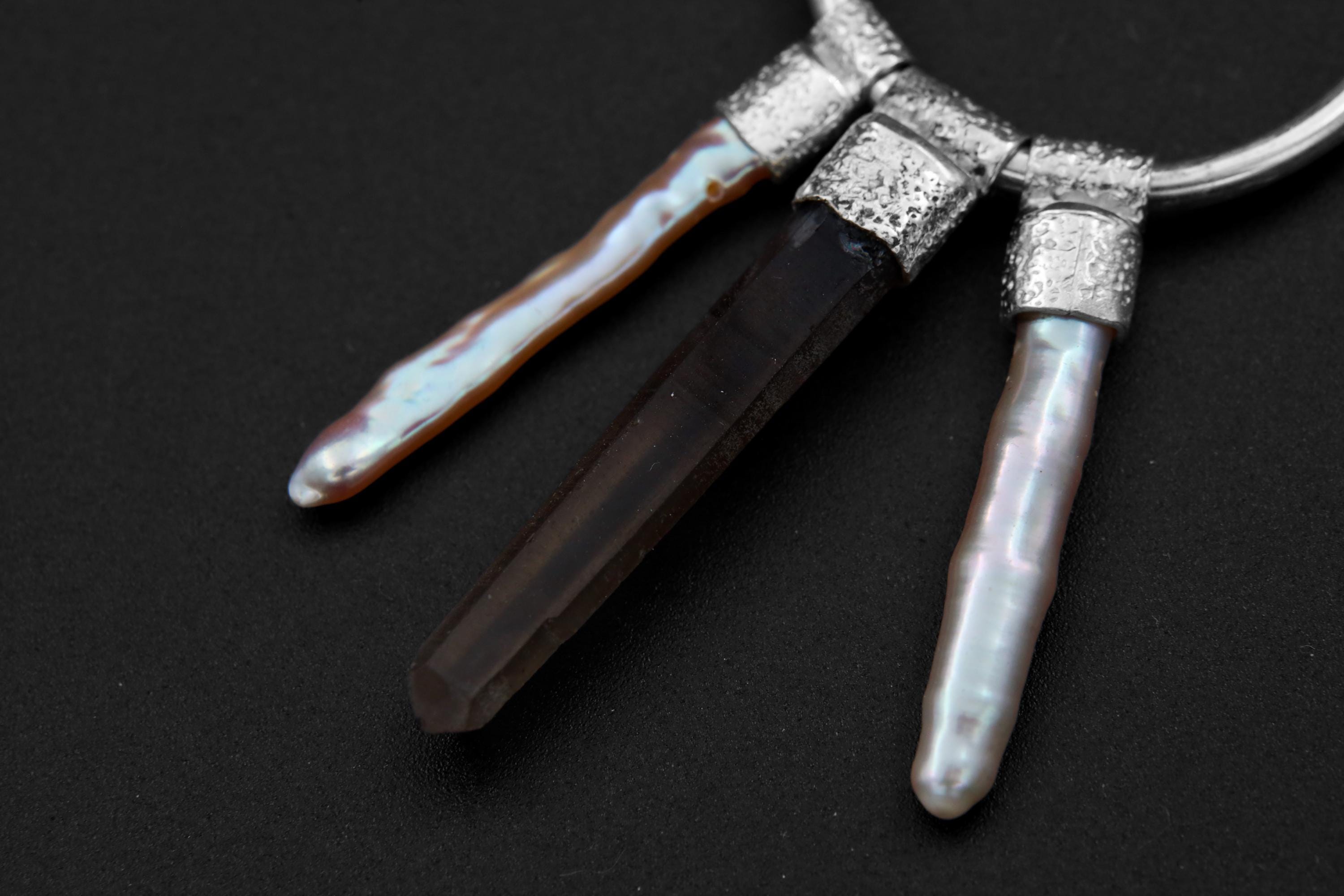 Close-up of Smoky Quartz and White Pearl dangles on sterling silver hoop earrings with polished handmade details.