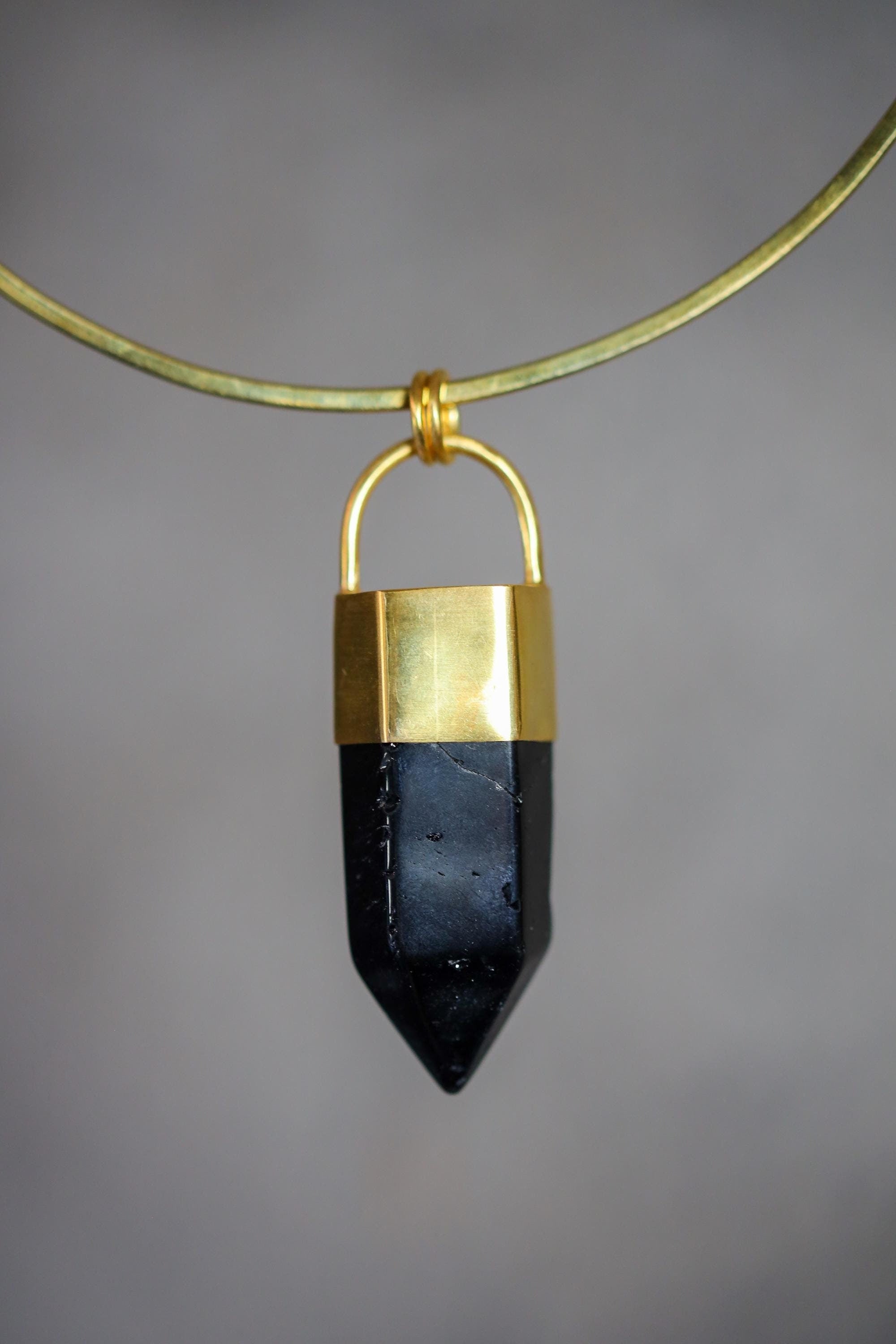 Smoky Quartz gold-capped crystal pendant displayed on a choker-style necklace with dark smoky point.