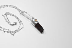 Blue Apatite Ethiopian Opal pendant shown with sterling silver chain, featuring a blue generator point and small opal accent.