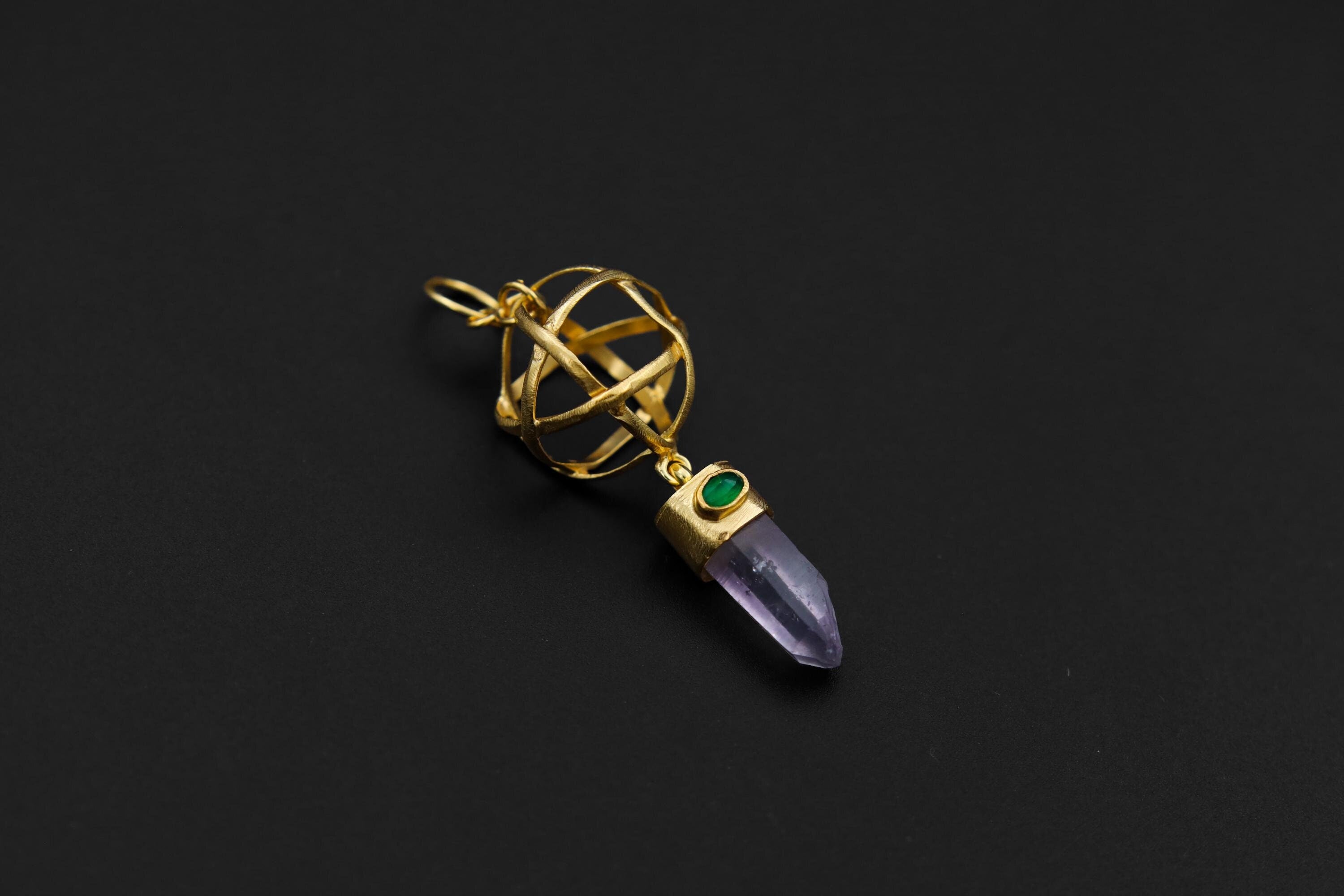 Vera Cruz Amethyst Emerald sphere pendant in 18k gold-plated sterling silver, shown on a dark background with geometric cage frame.