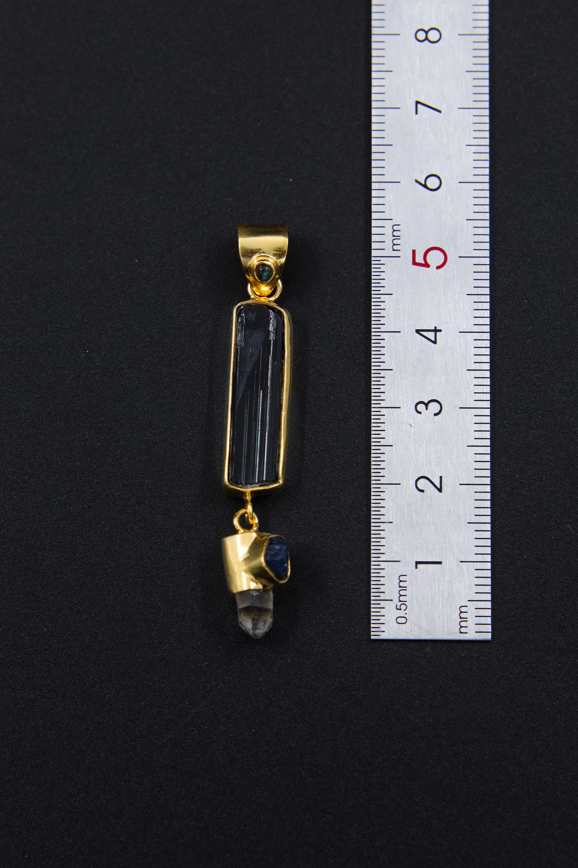 Blue Moonstone Tourmaline Smoky Quartz Sapphire pendant shown beside a ruler for scale, measuring approximately 4.5 to 5 cm long.