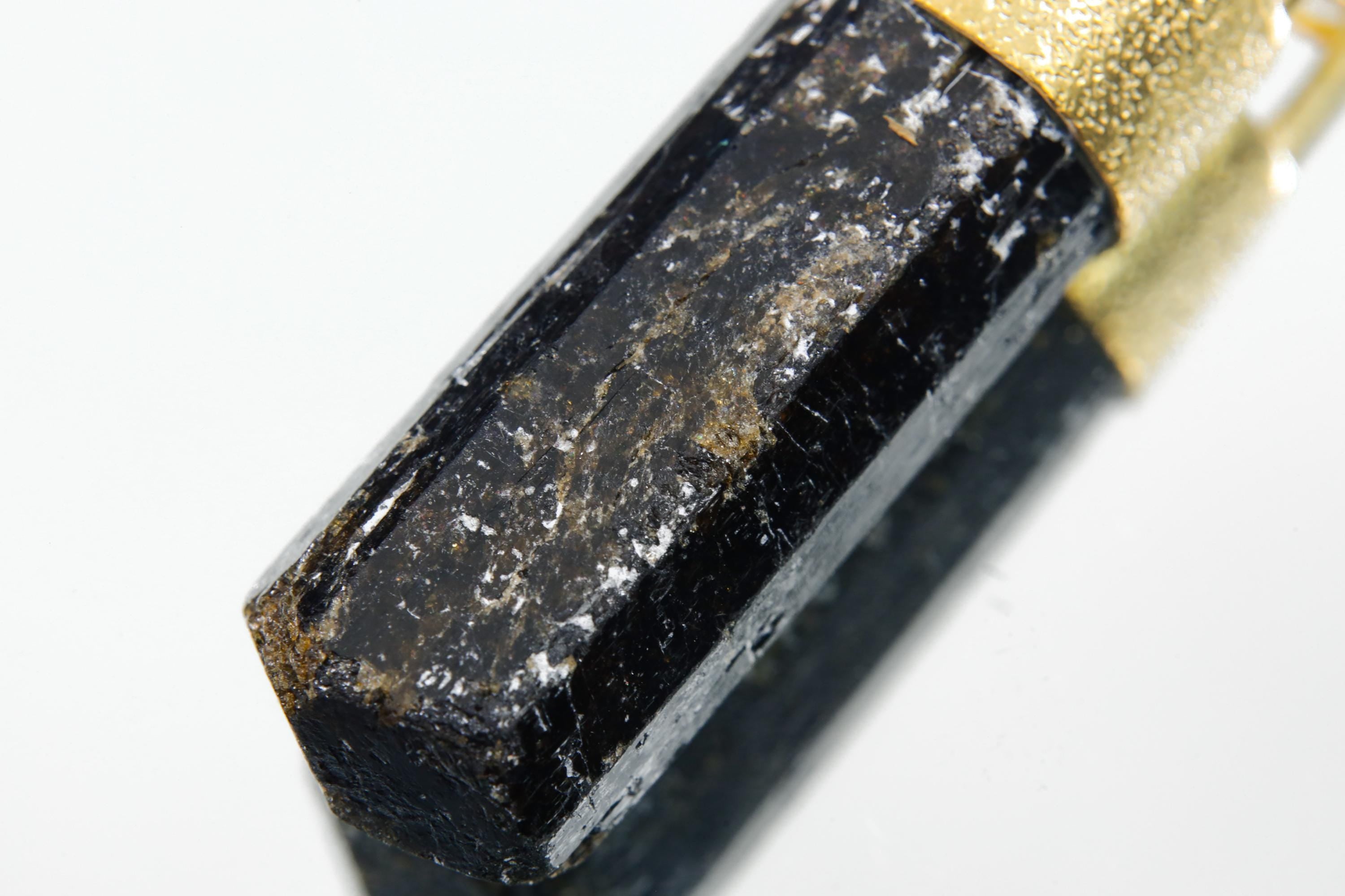 Himalayan Dravite Diamond pendant shown on a necklace, with dark earthy Tourmaline and warm gold-plated cap.