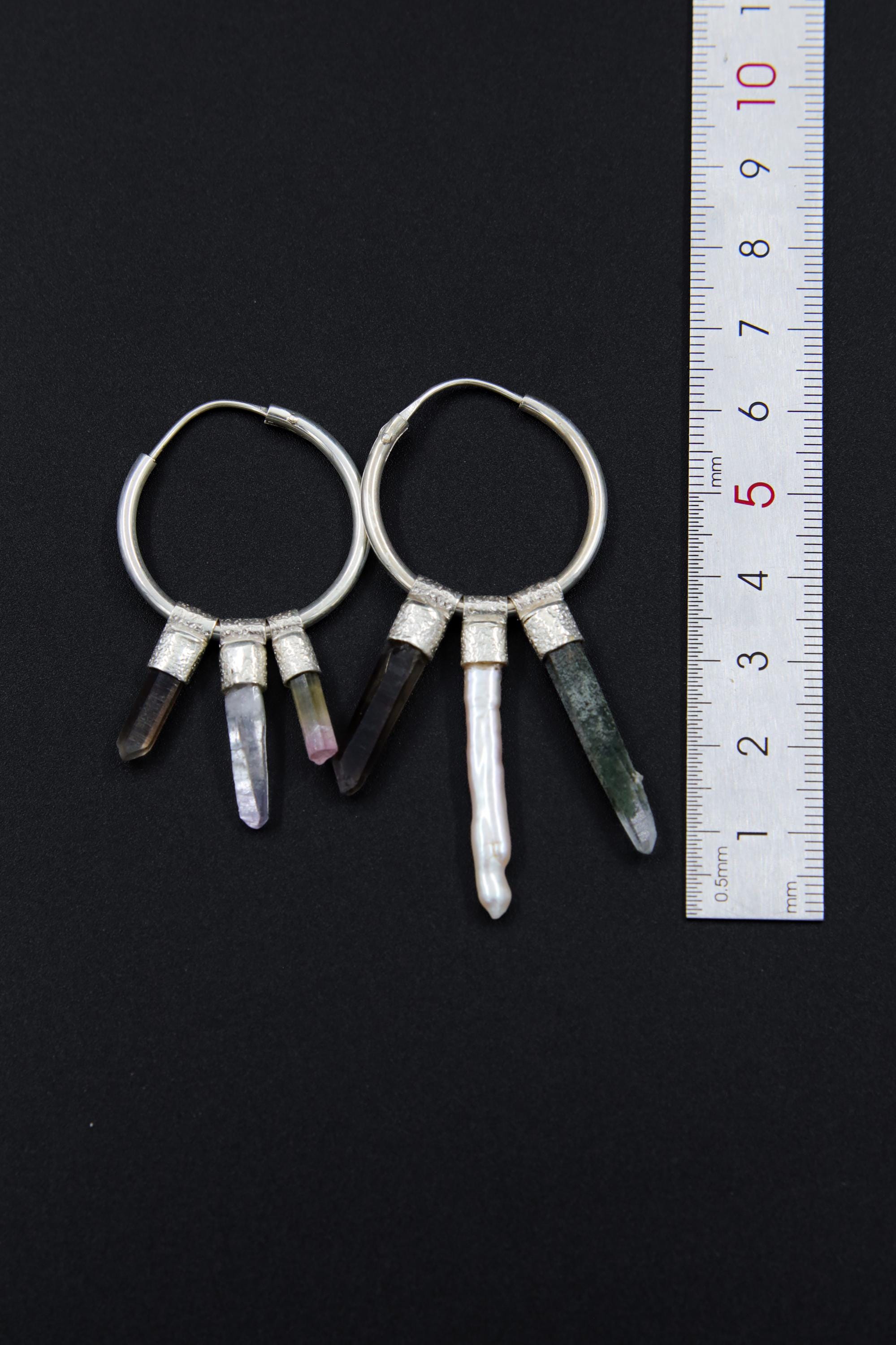Celestial Gatherer crystal stack hoop earrings shown beside a ruler for scale with large sterling silver hoops.