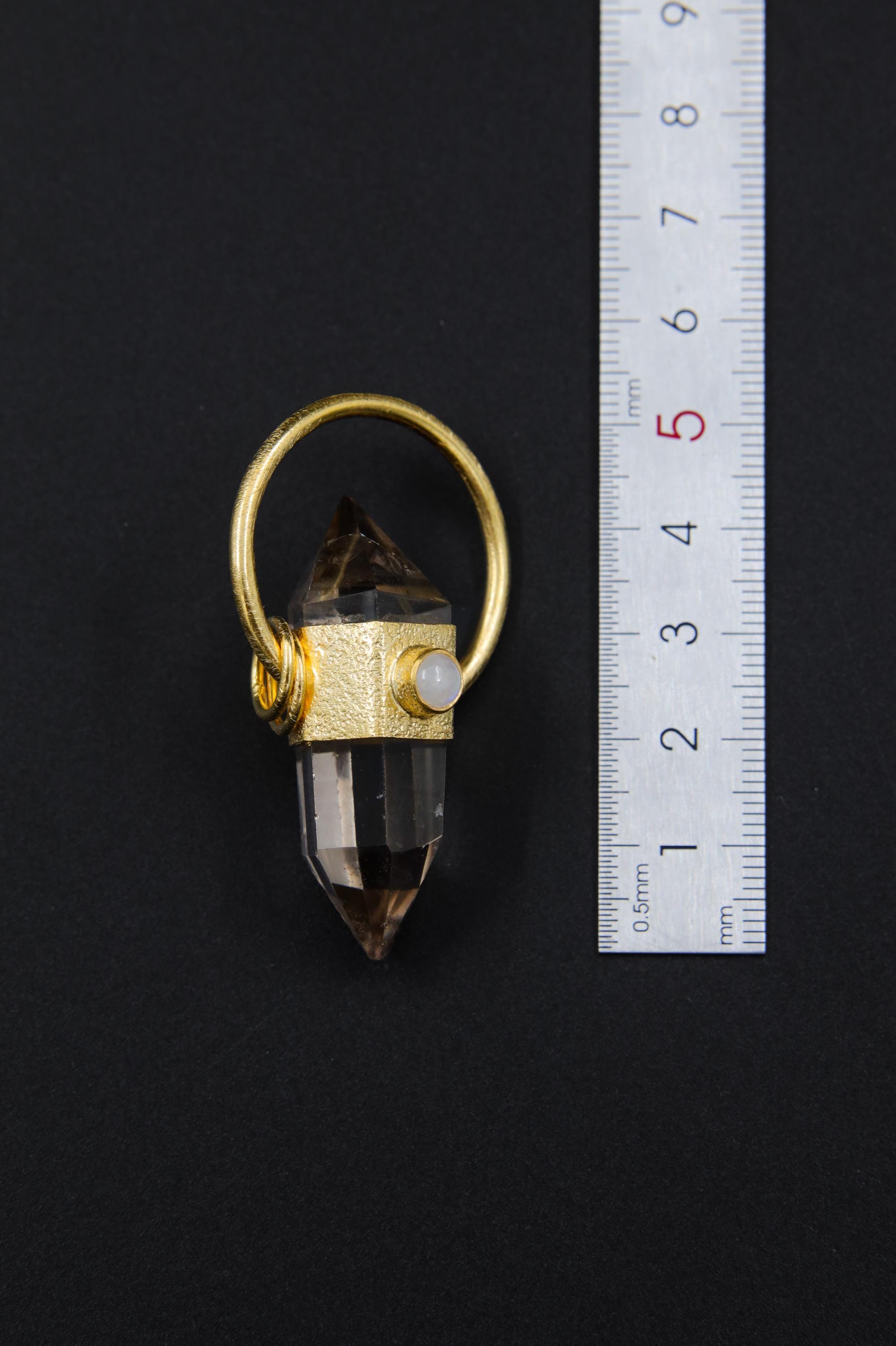 Citrine Generator Quartz Moonstone halo pendant shown beside a ruler for scale, measuring approximately 4.5 to 5 cm total length including bail.