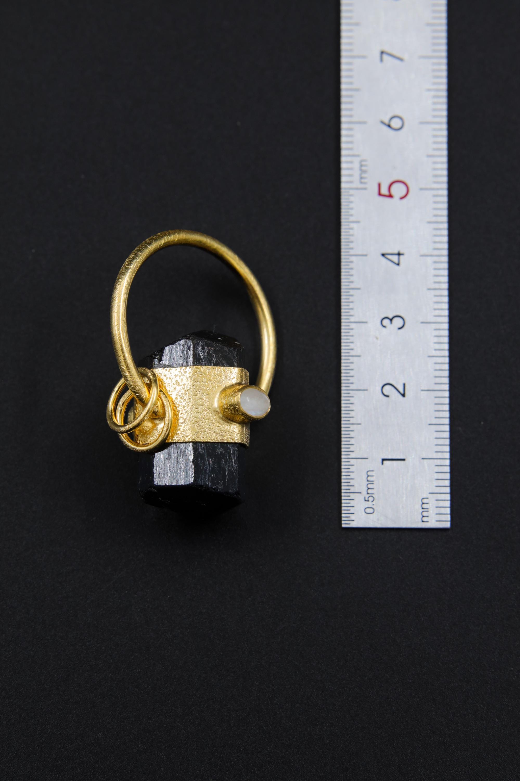 Black Tourmaline Moonstone halo pendant shown beside a ruler for scale, measuring approximately 3.5 cm total length including bail.