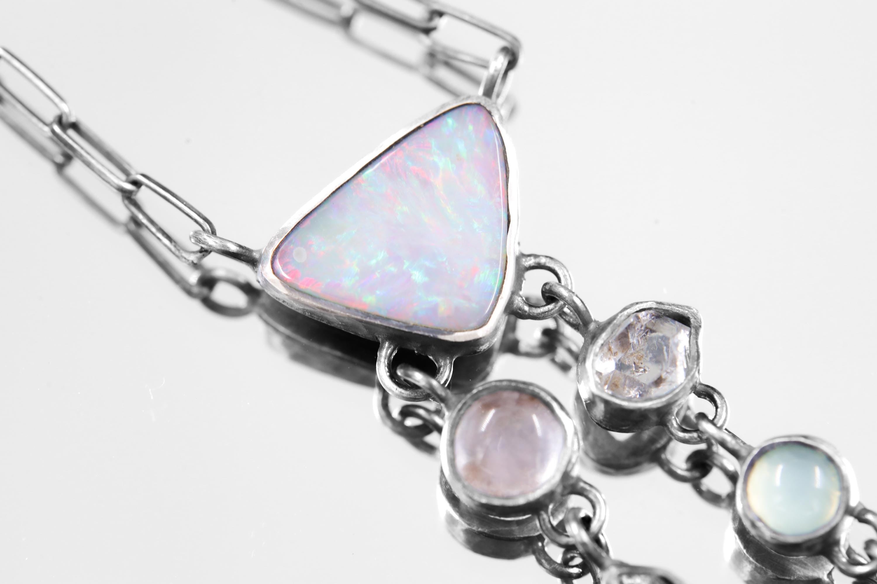 Close-up of Australian Opal, Rose Quartz, Aquamarine, Herkimer Diamond, and Pearl in a high-polish sterling silver pendant.