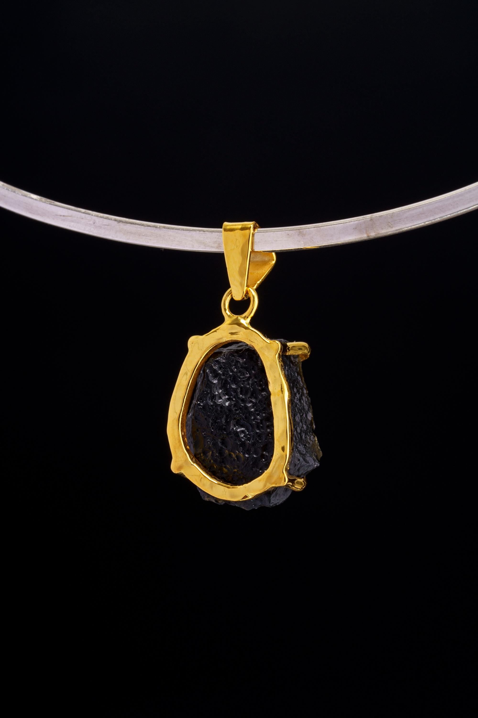 Darwin Glass pendant worn on choker against black background as a Crown Chakra cosmic talisman.