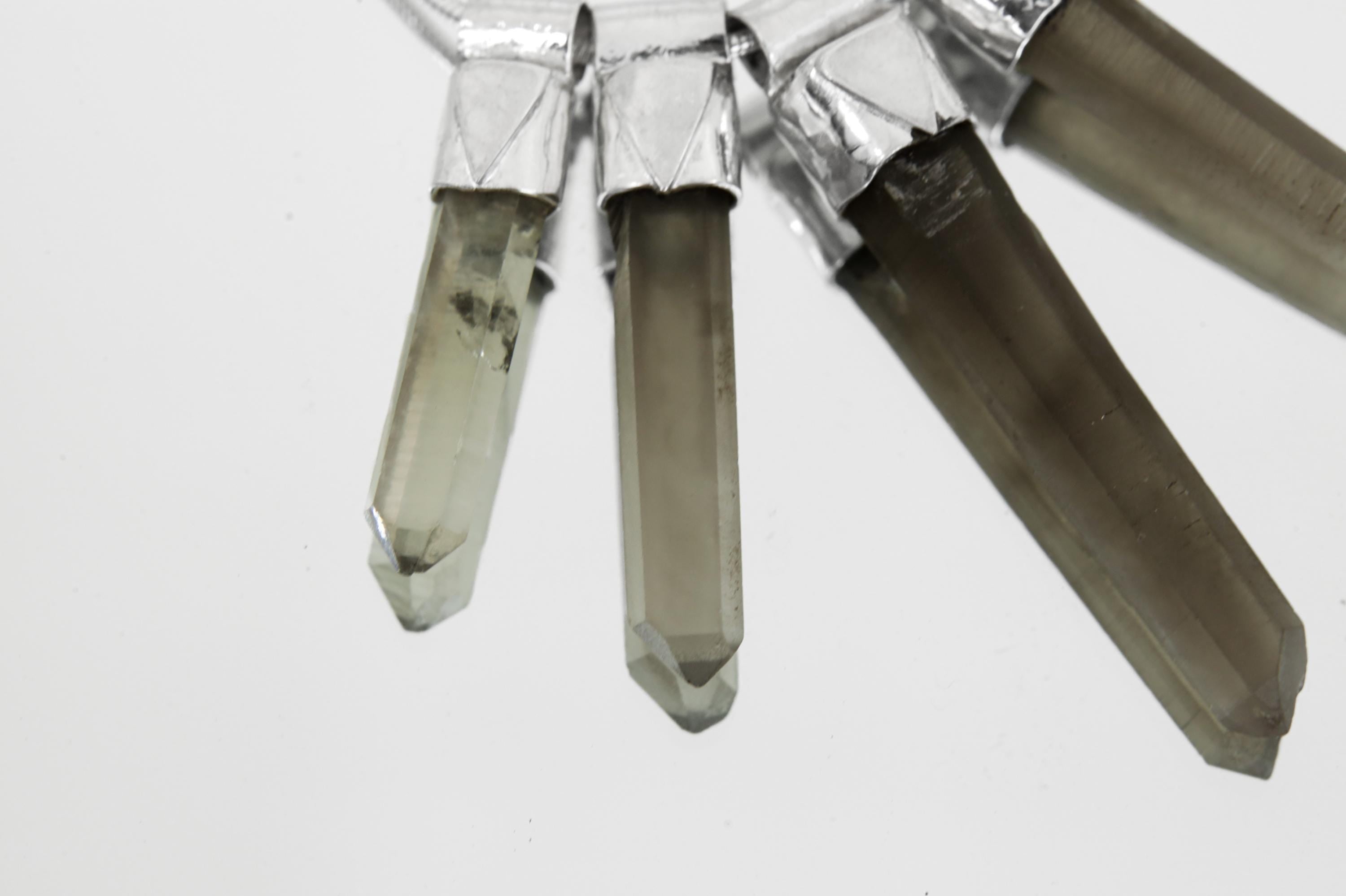 Close-up of five Australian Smoky Citrine Phantom Quartz crystals showing natural phantom inclusions and earthy colour variation.