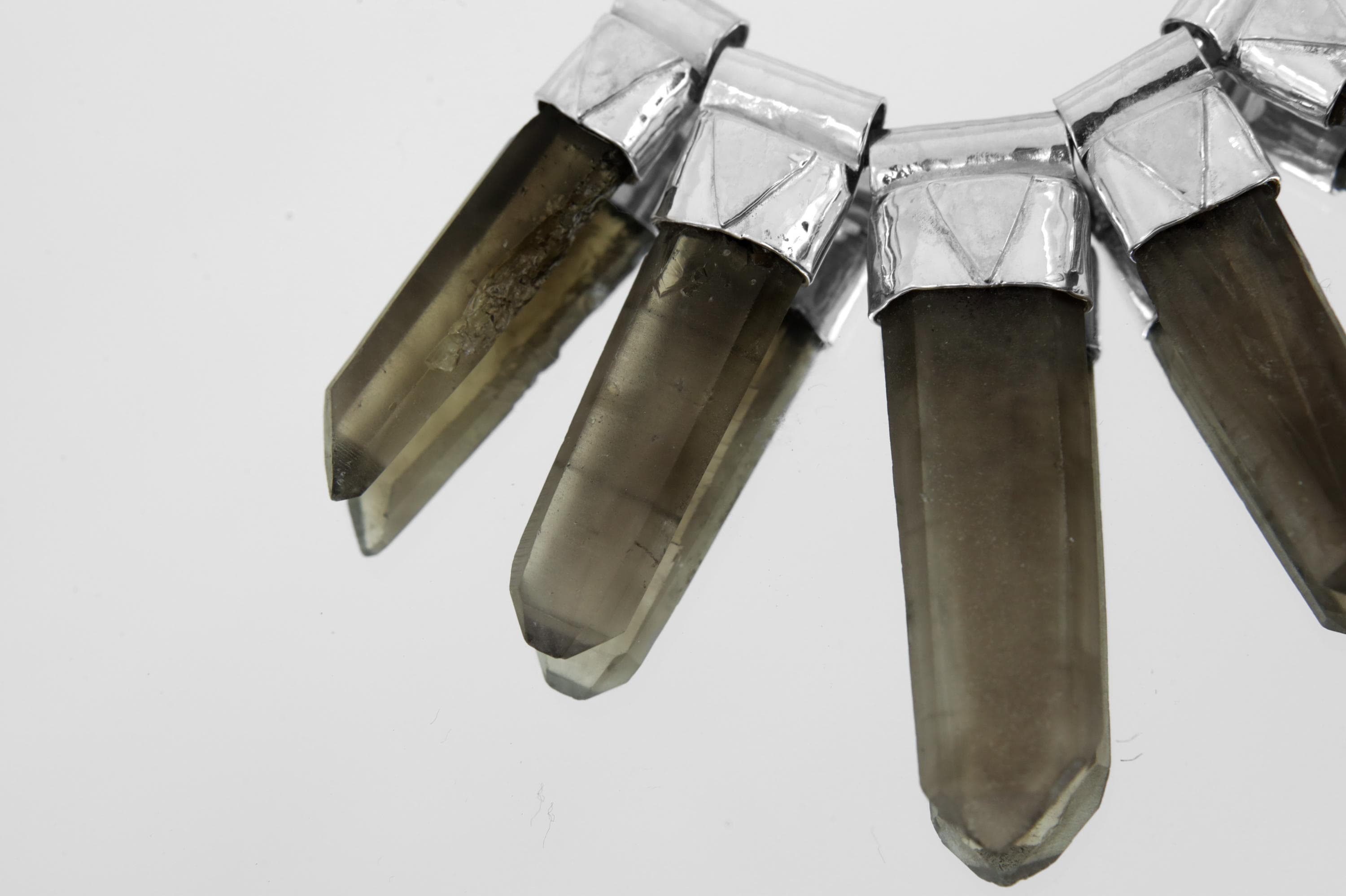 Close-up of eight Australian Smoky Citrine Phantom Quartz crystal drops showing natural phantom inclusions and earthy colour variation.