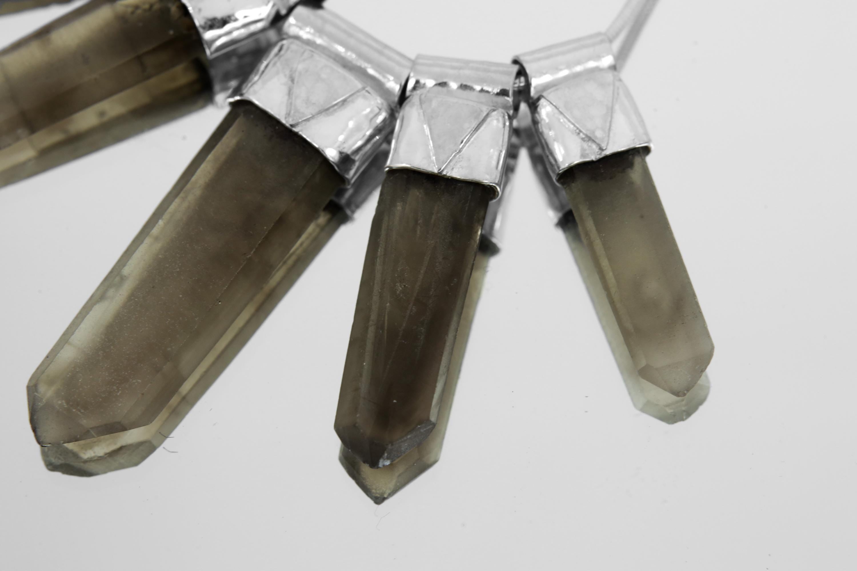 Close-up of Australian Smoky Citrine Phantom Quartz crystals showing smoky-golden tones and hammered sterling silver details.