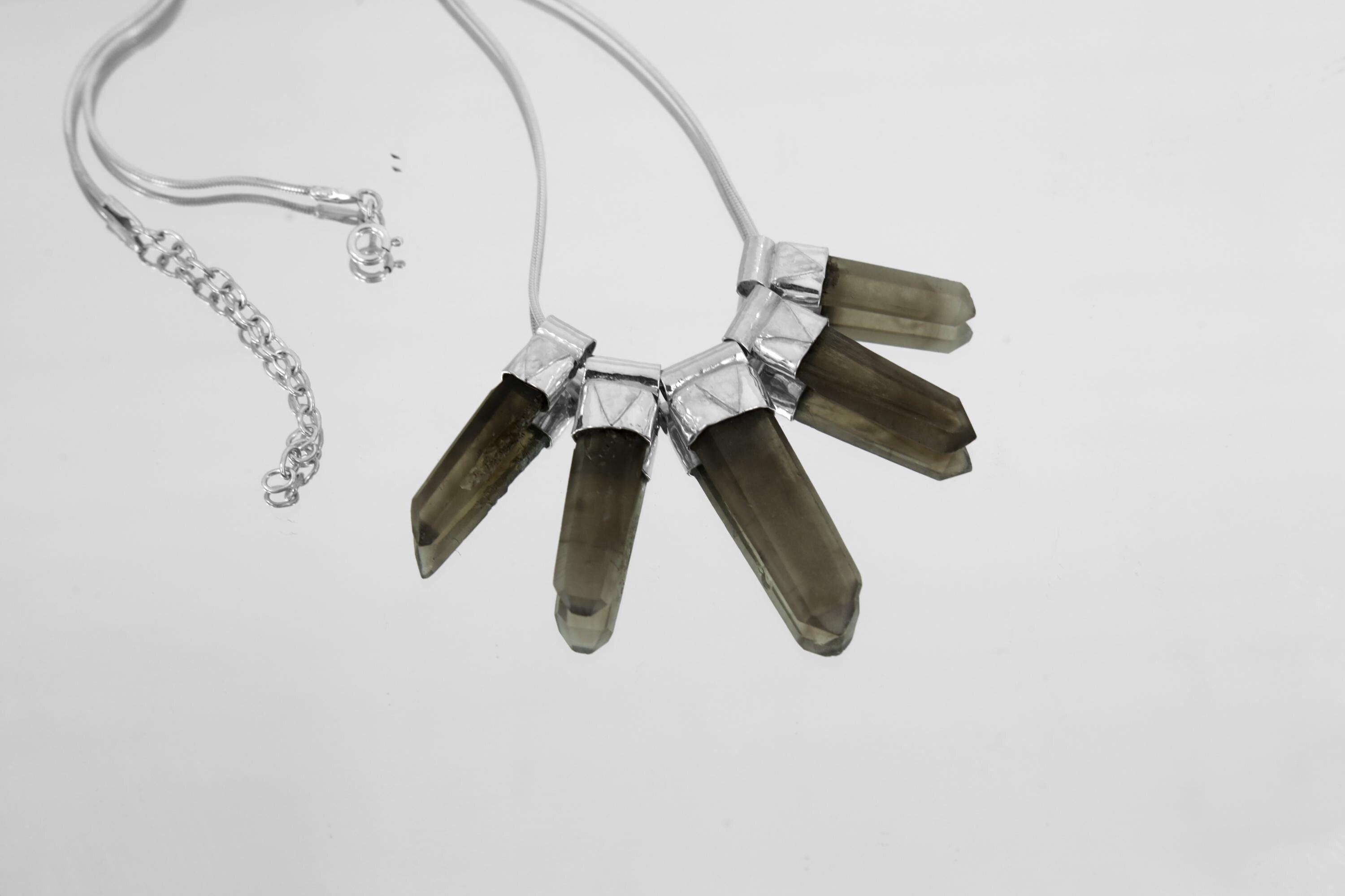 Australian Smoky Citrine Phantom Quartz necklace shown on light background with five crystals and hammer-brushed sterling silver setting.