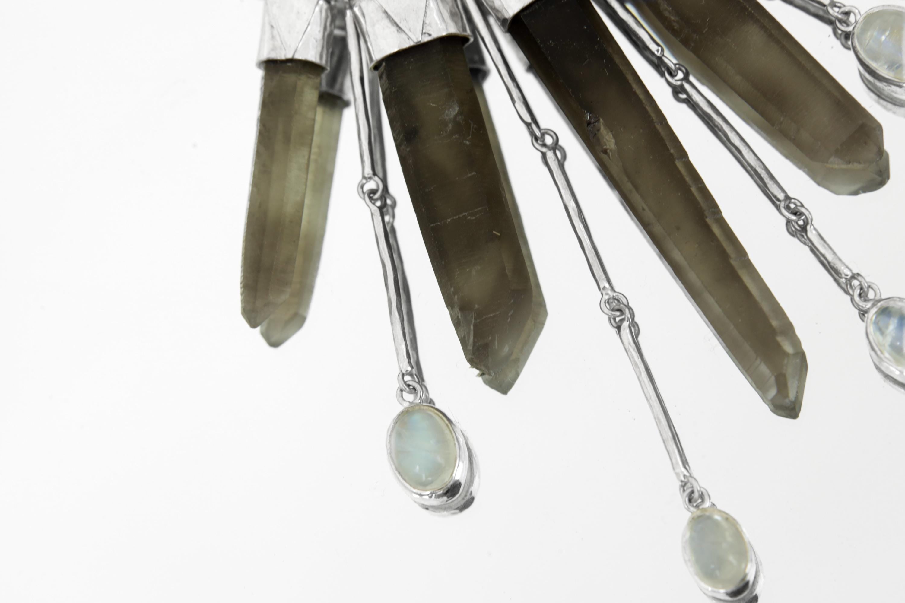 Close-up of Smoky Citrine Phantom Quartz crystals showing smoky-golden tones, phantom inclusions, and small Moonstone detail.