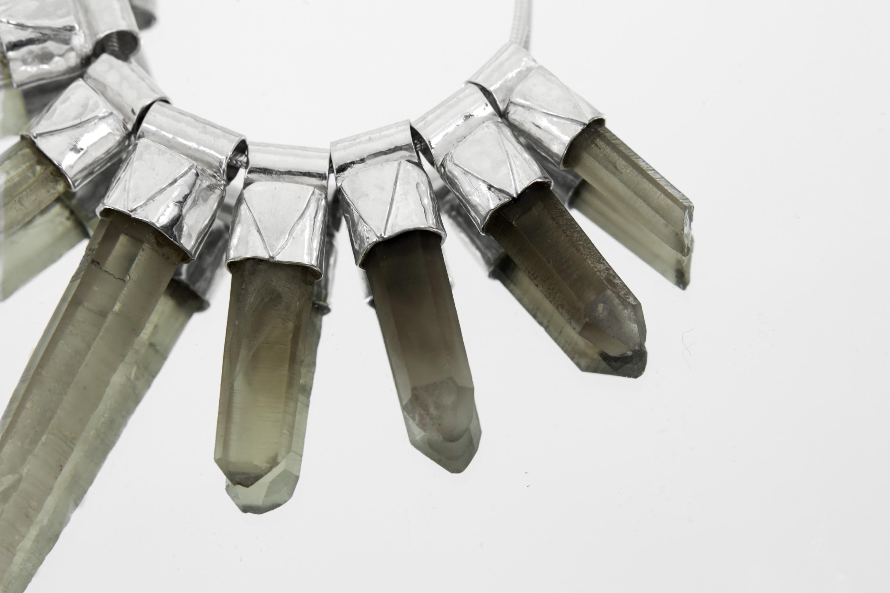 Close-up of eight Australian Smoky Citrine Phantom Quartz crystals showing natural phantom inclusions and earthy colour variation.