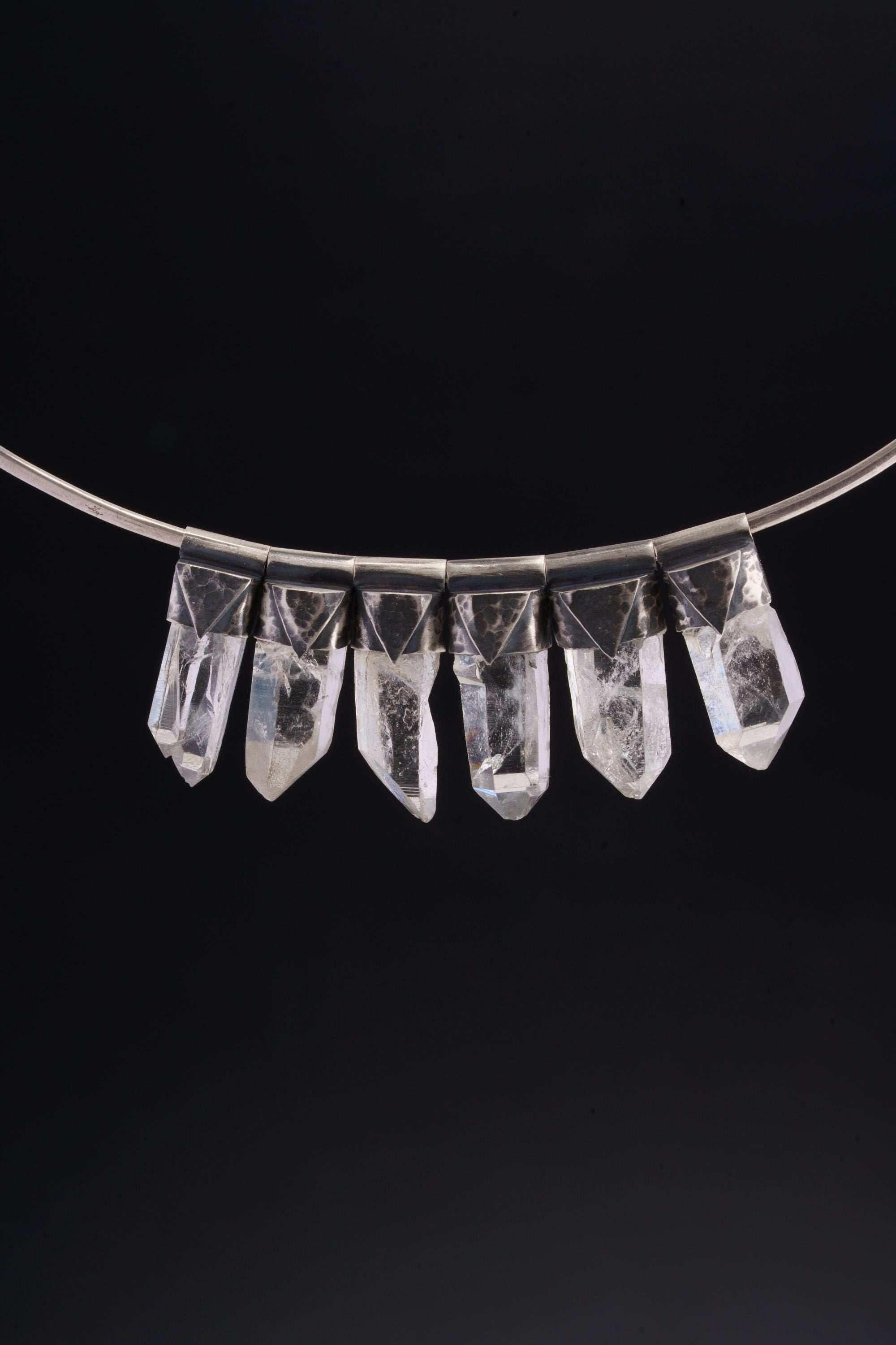 Water Clear Nepalese Inclusion Quartz pendant shown as part of a small clear crystal pendant collection.