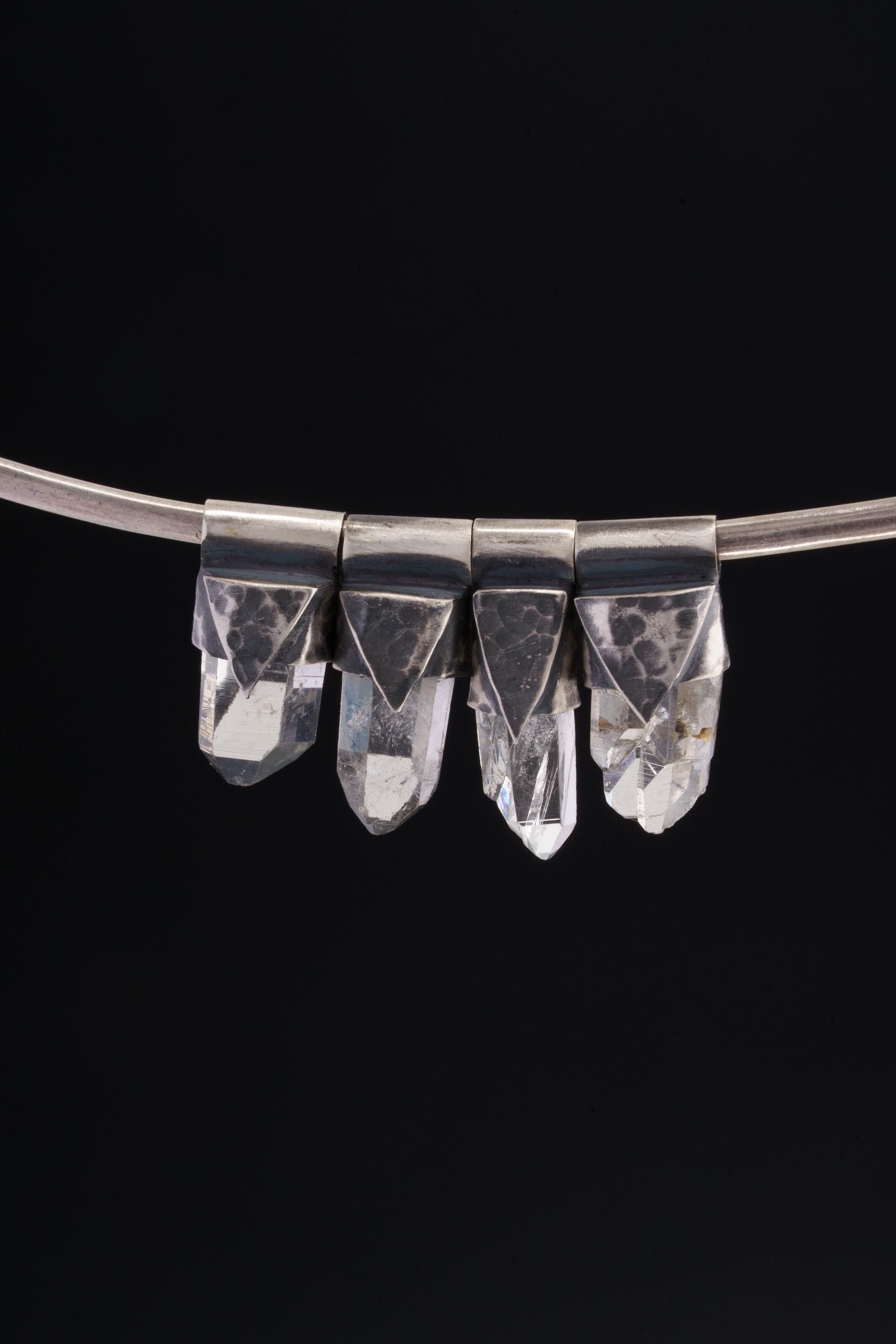 Water Clear Nepalese Inclusion Quartz pendant shown as part of a small clear crystal pendant collection.
