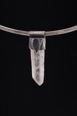 Water Clear Nepalese Inclusion Quartz Pendant shown on black background with oxidized silver cap and raw clear Quartz point.