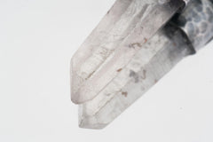 Close-up of Water Clear Nepalese Inclusion Quartz showing natural internal inclusions, bright clarity, and raw crystal texture.