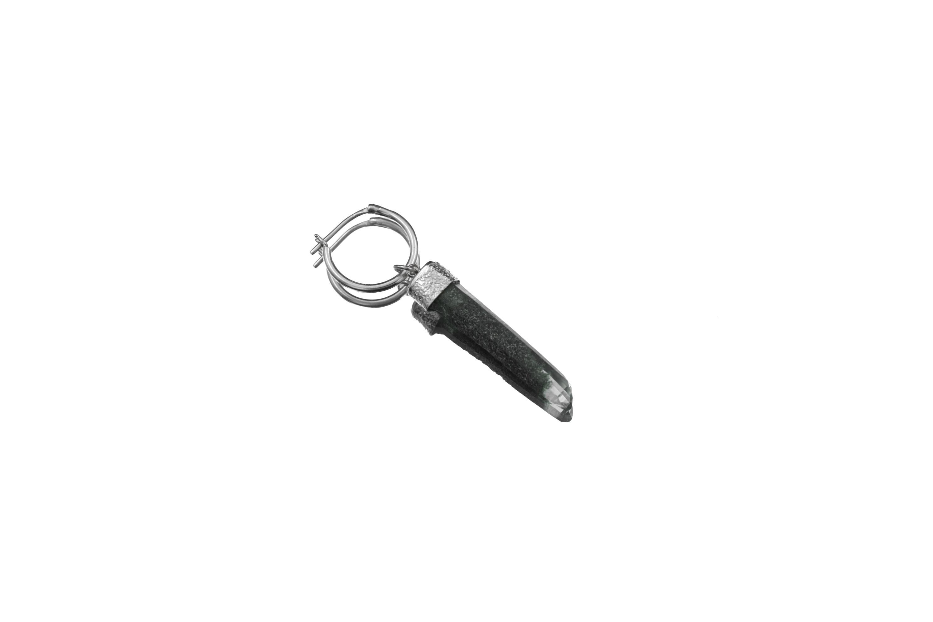 Single Chlorite Quartz hoop earring displayed on white background, showing raw dark crystal drop and polished silver hoop.