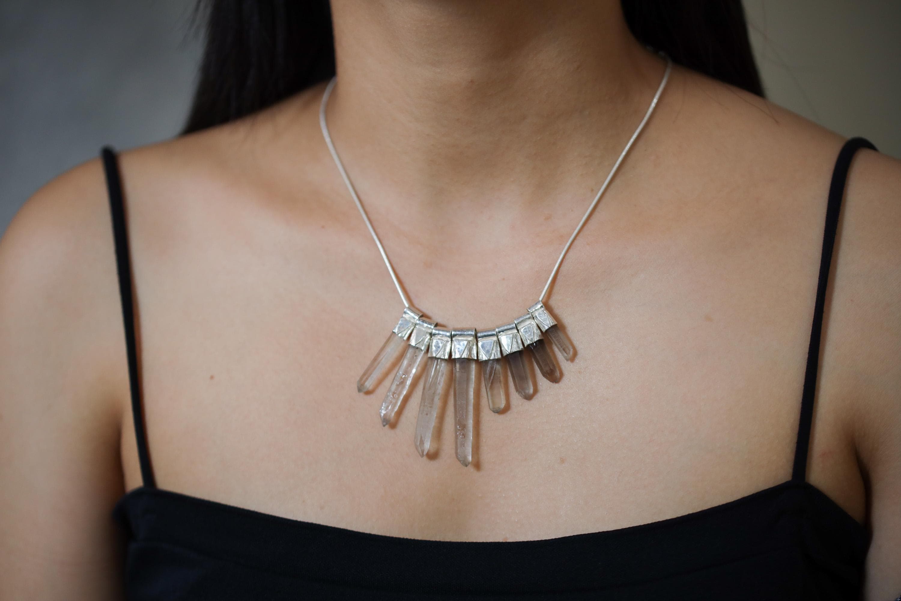 Australian Smoky Citrine Phantom Quartz necklace shown worn on the chest with eight cascading crystals and sterling silver chain.
