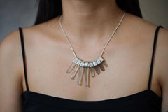 Australian Smoky Citrine Phantom Quartz necklace shown worn on the chest with eight cascading crystals and sterling silver chain.