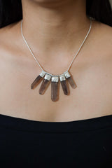 Australian Smoky Citrine Phantom Quartz necklace shown worn on the chest with five cascading crystal drops and sterling silver chain.
