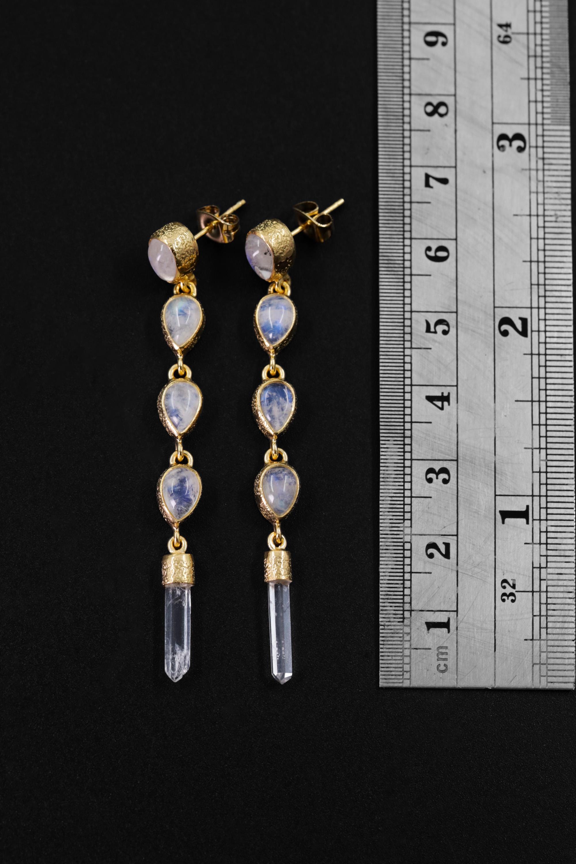 Blue Moonstone and Clear Quartz gold-plated stud drop earrings shown beside a ruler for length reference.