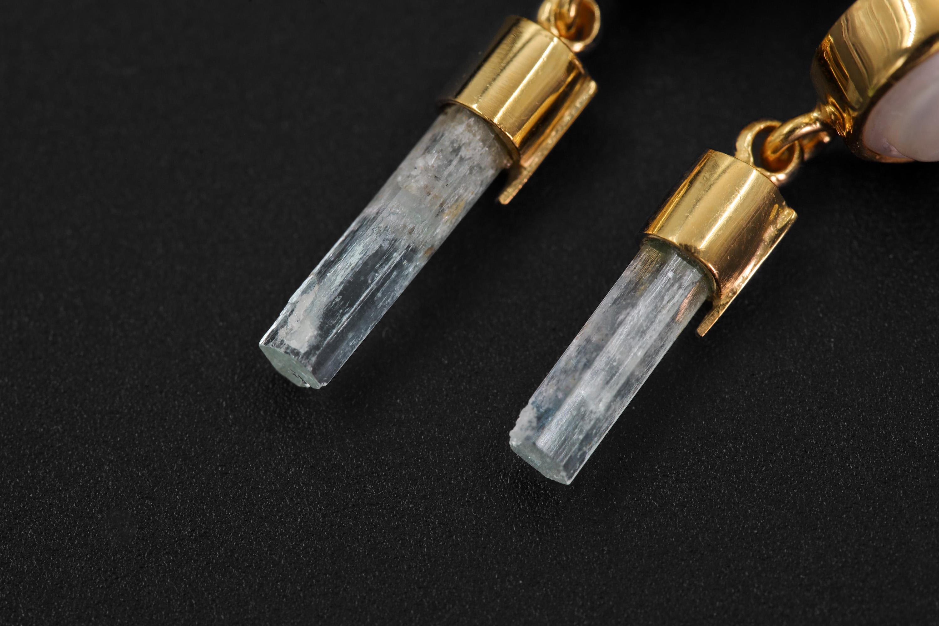 Close view of Pearl and Aquamarine stud drop earrings showing gold-plated caps, creamy pearl lustre, and blue crystal dangles.