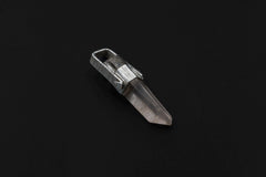 Raw Lemurian Laser Quartz pendant shown on a dark background, wrapped in high-shine sterling silver with secure loop.