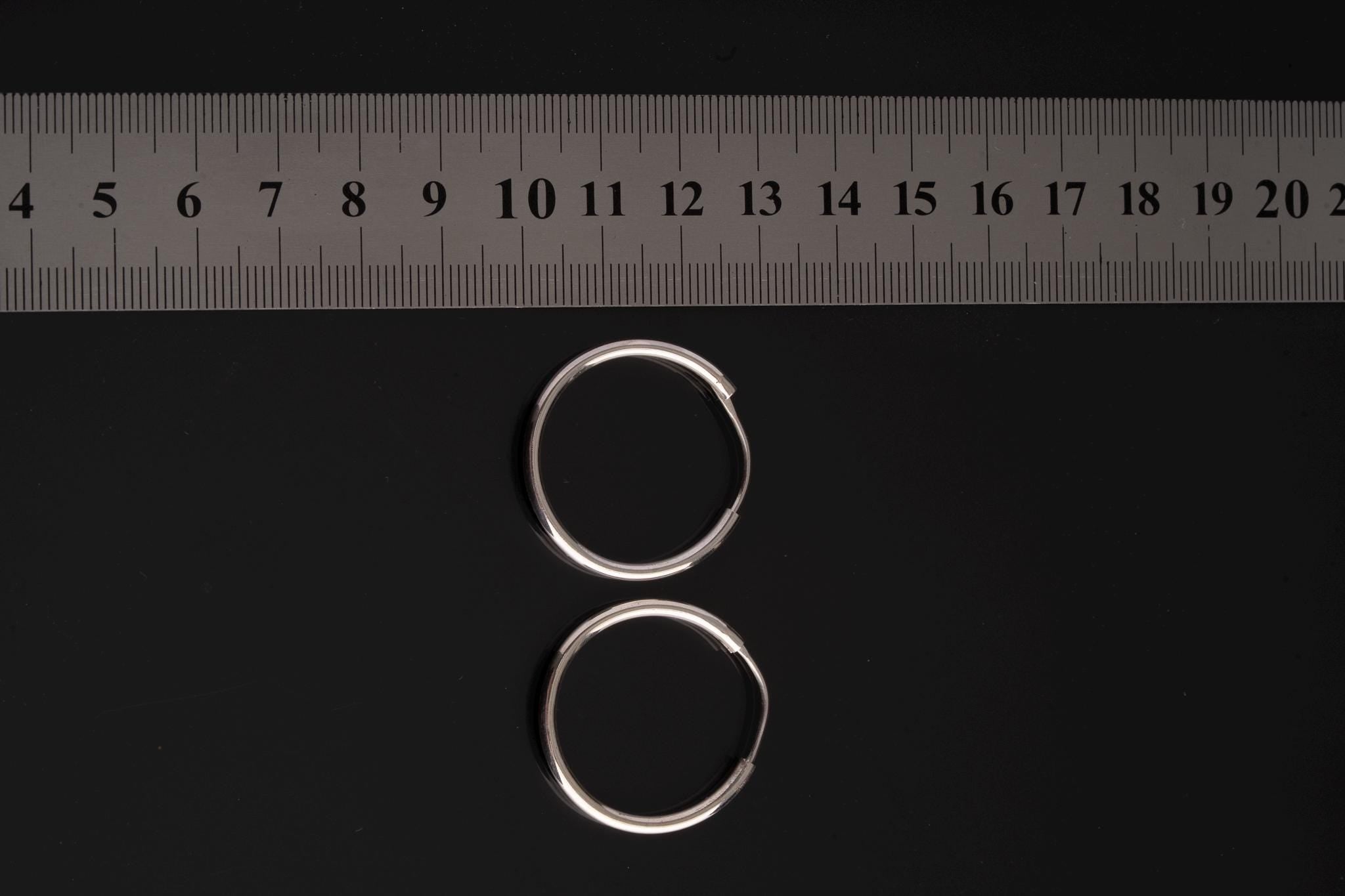 Opal Leaf Hoop Earrings shown beside a ruler for scale, with 12 mm sterling silver hoops and small leaf charms.