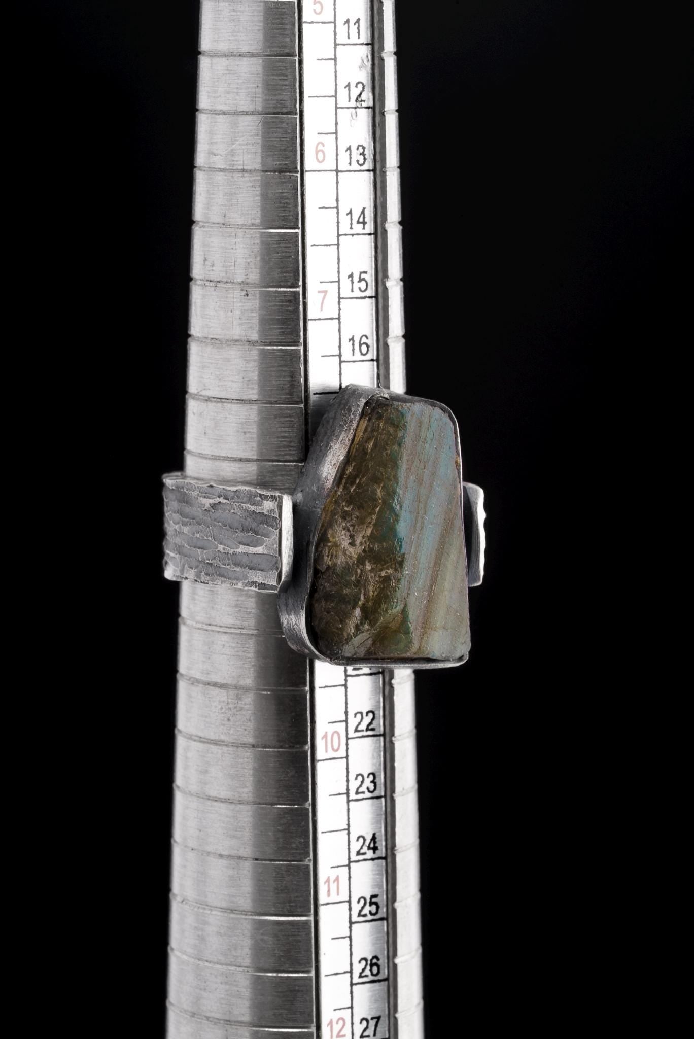 Raw Labradorite sterling silver ring shown on mandrel for US size 9 reference.