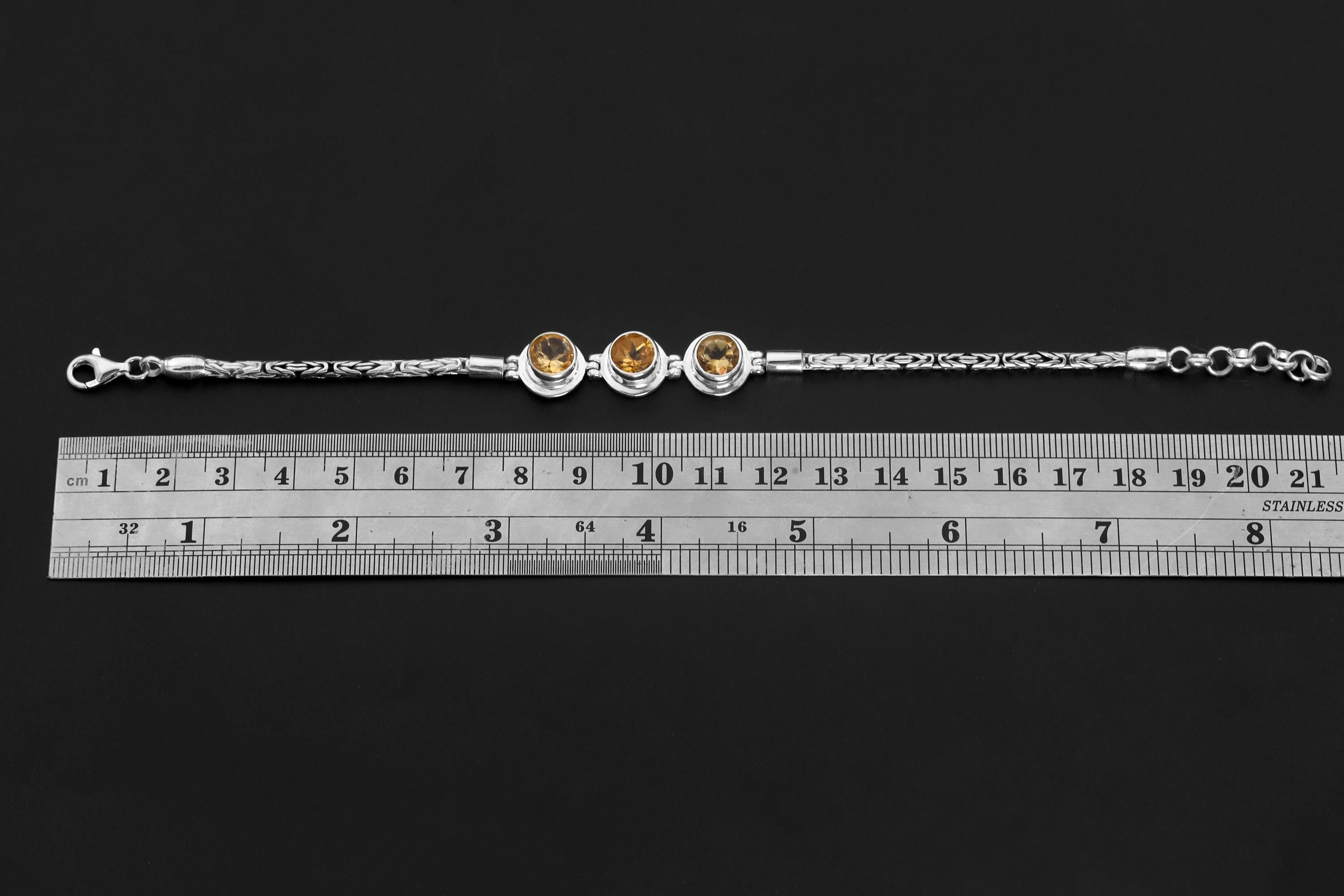 Citrine Byzantine sterling silver bracelet shown beside a ruler for adjustable 18 to 21 cm size reference.