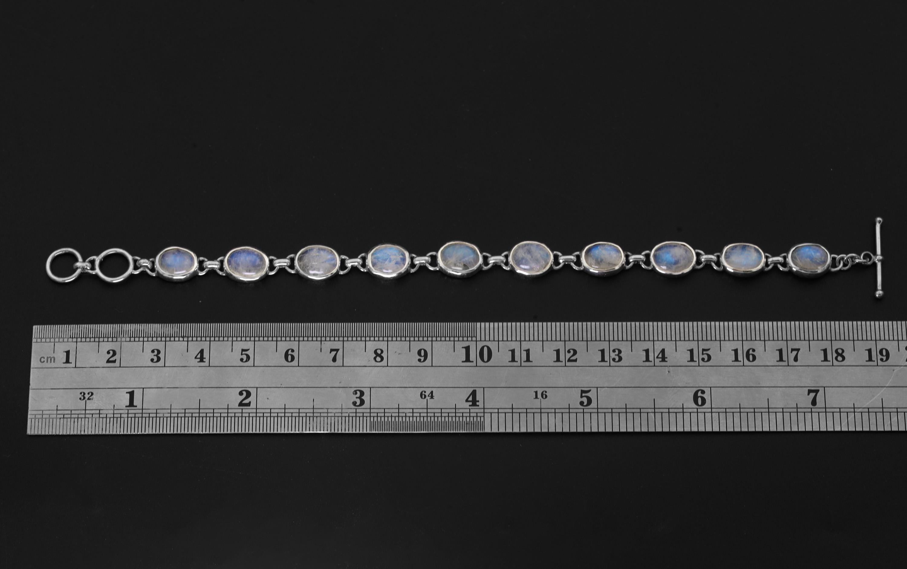 Blue Moonstone sterling silver bracelet shown beside a ruler for approximately 20 cm length reference.