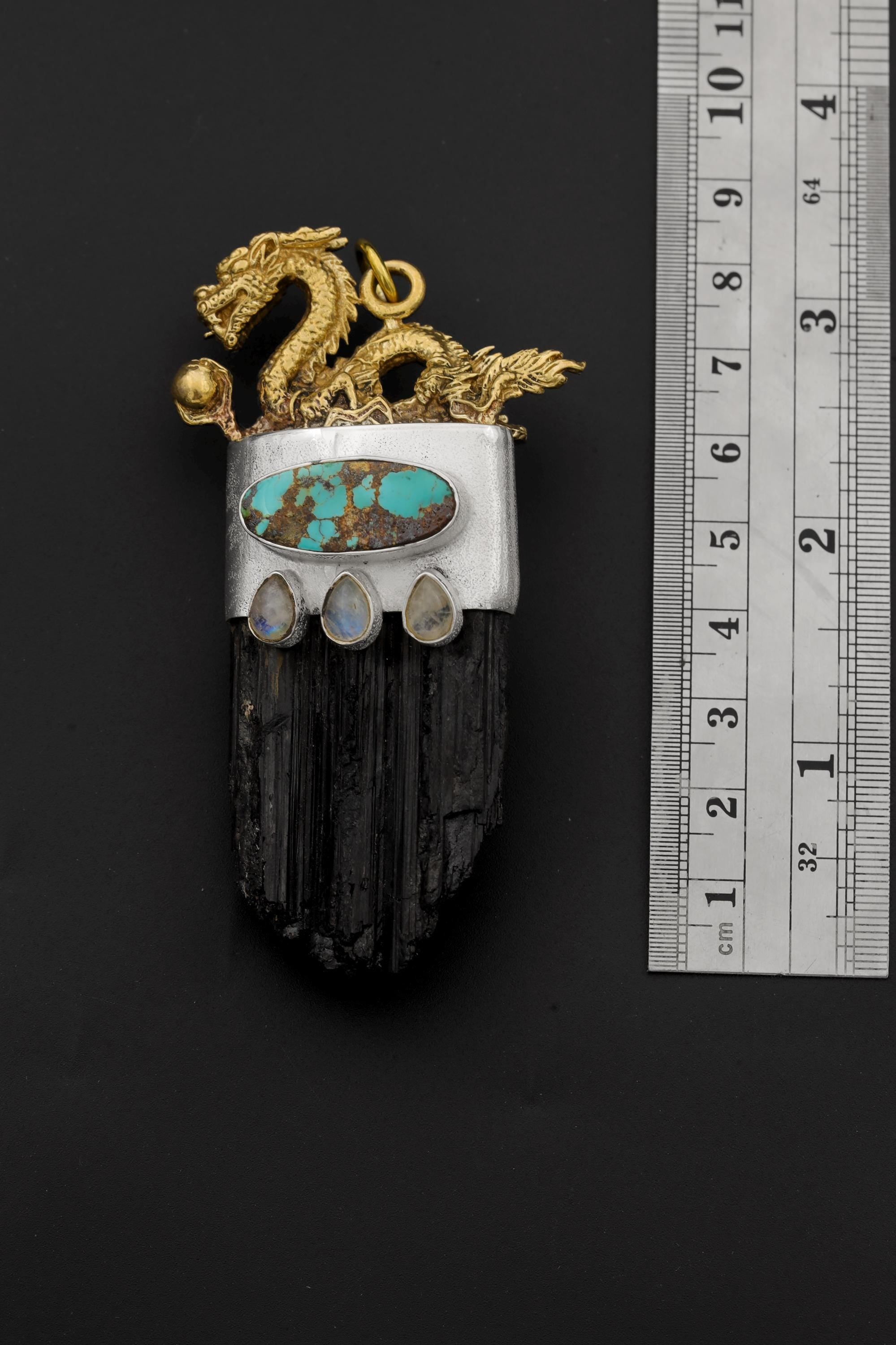 Measurement photo beside ruler indicating pendant length and dragon top proportion.
