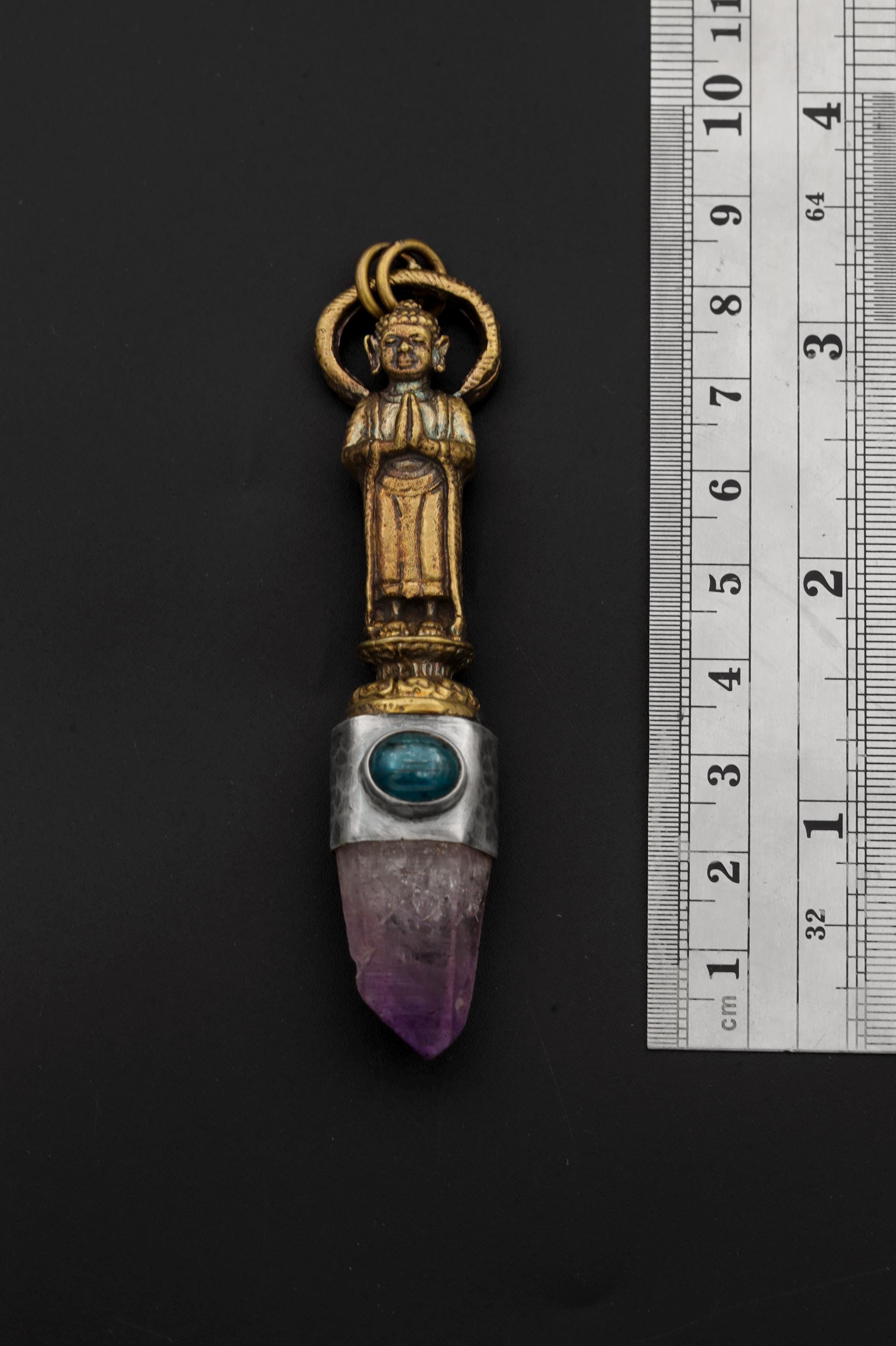 Measurement photo beside ruler showing pendant size and bail design detail.