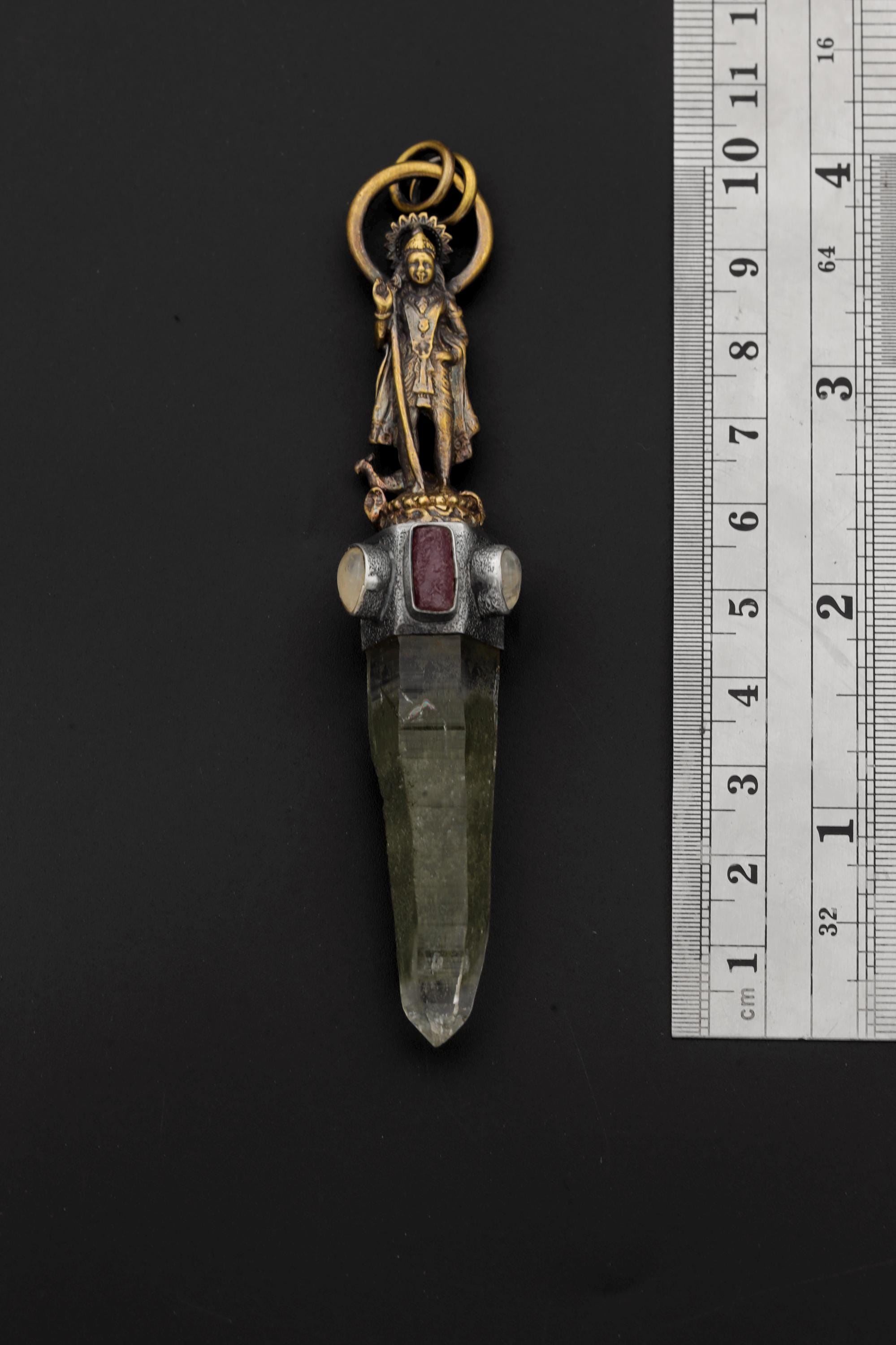 Measurement photo with ruler alongside pendant clearly showing total length and quartz point dimension.